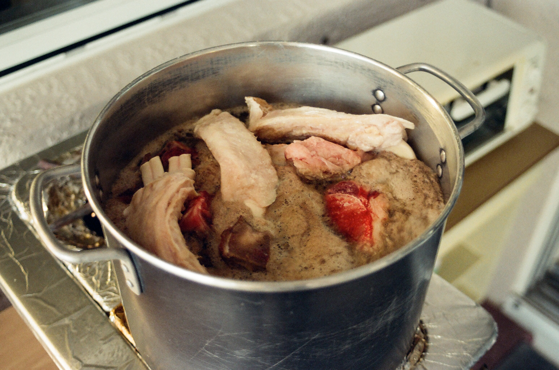 The broth's richness comes from beef bones and a whole chicken.