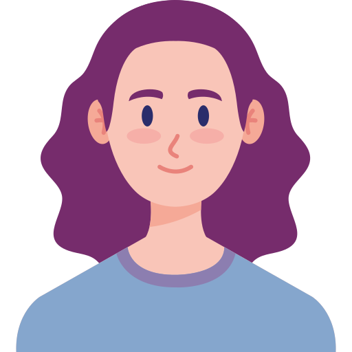 A person with long hair is smiling.