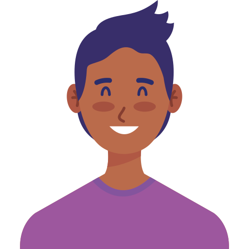 A person with short hair smiling.