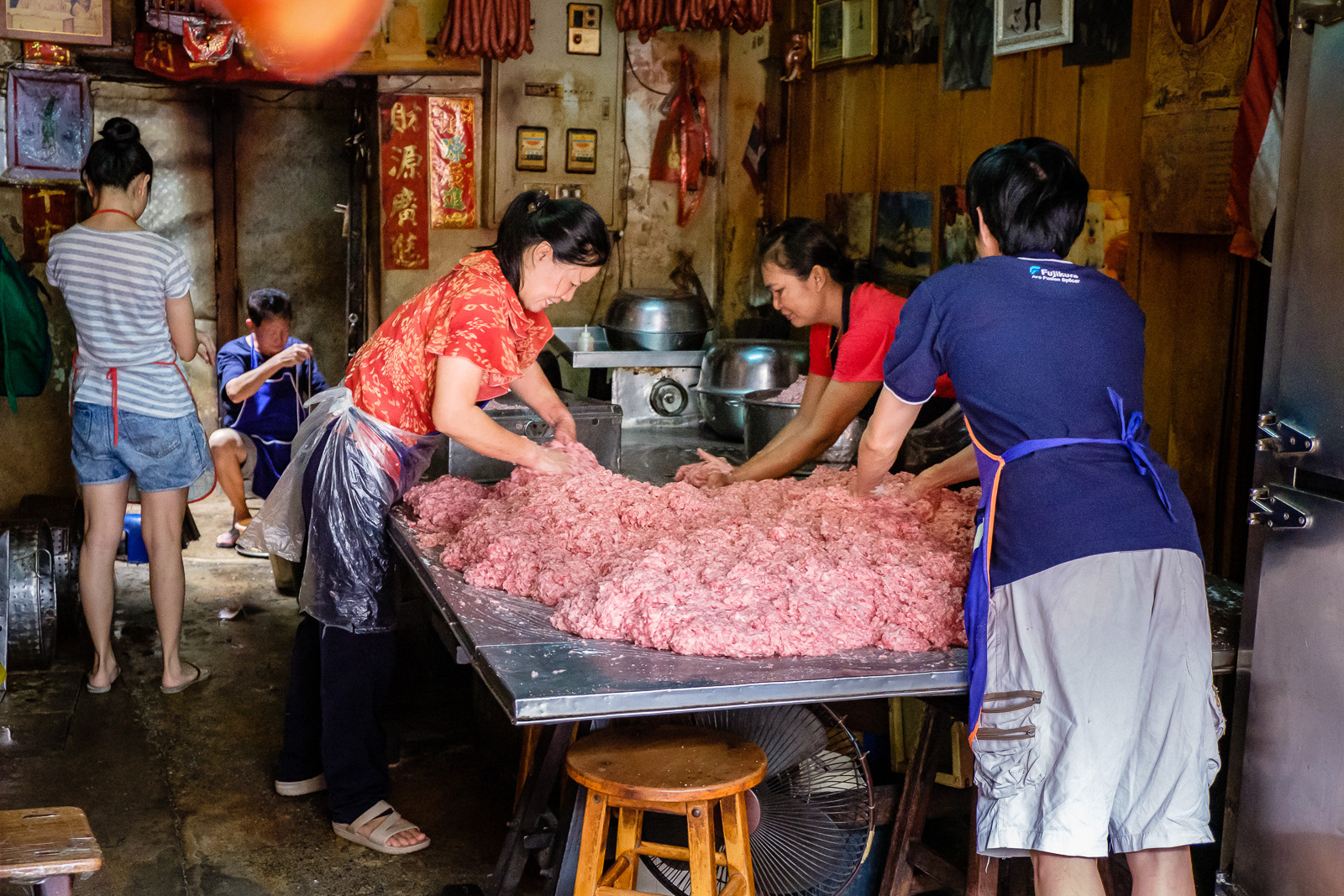 The meat, fat and spices are mixed