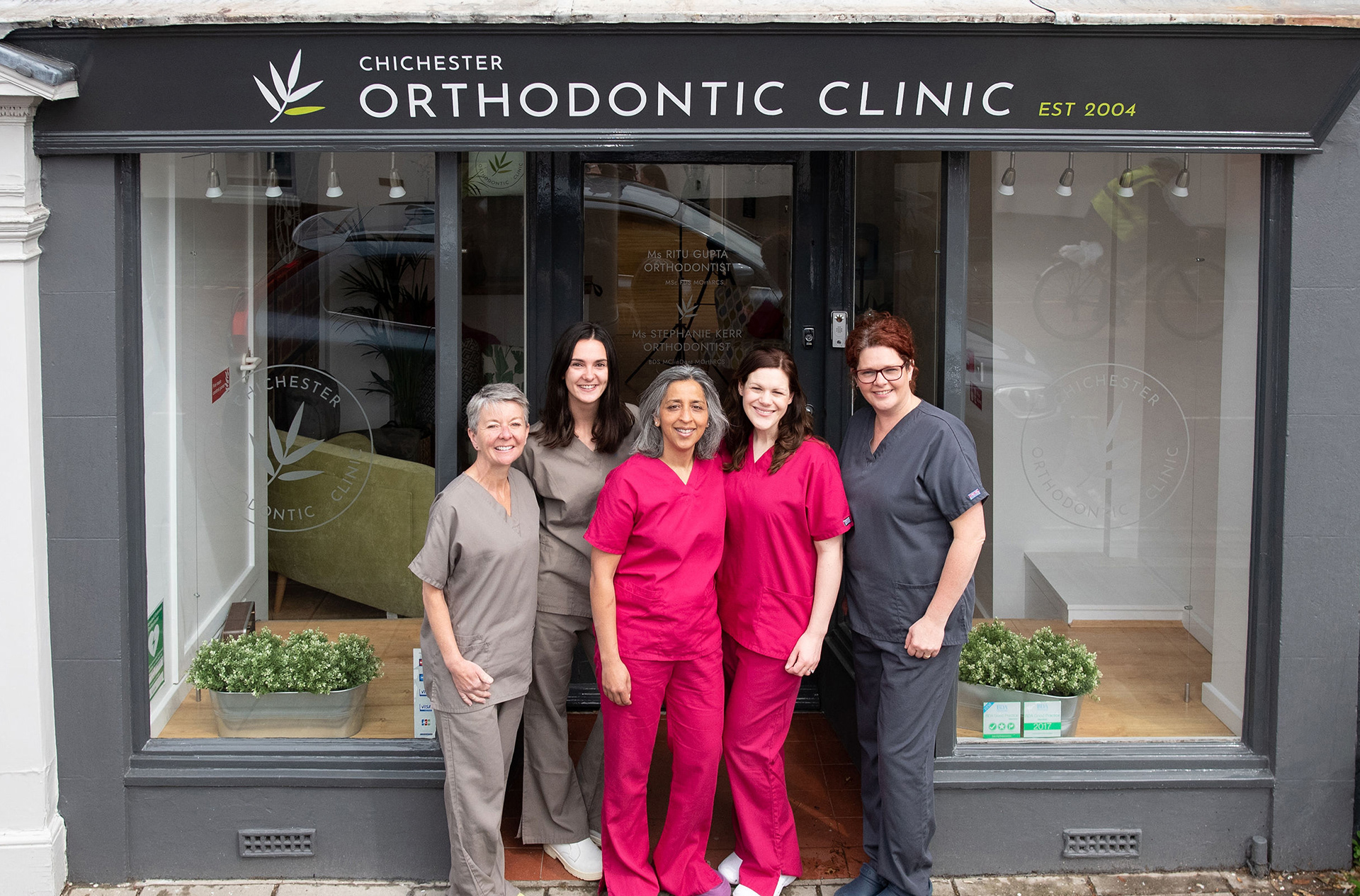 Chichester Orthodontic Clinic exterior fascia & window vinyl graphics image with staff