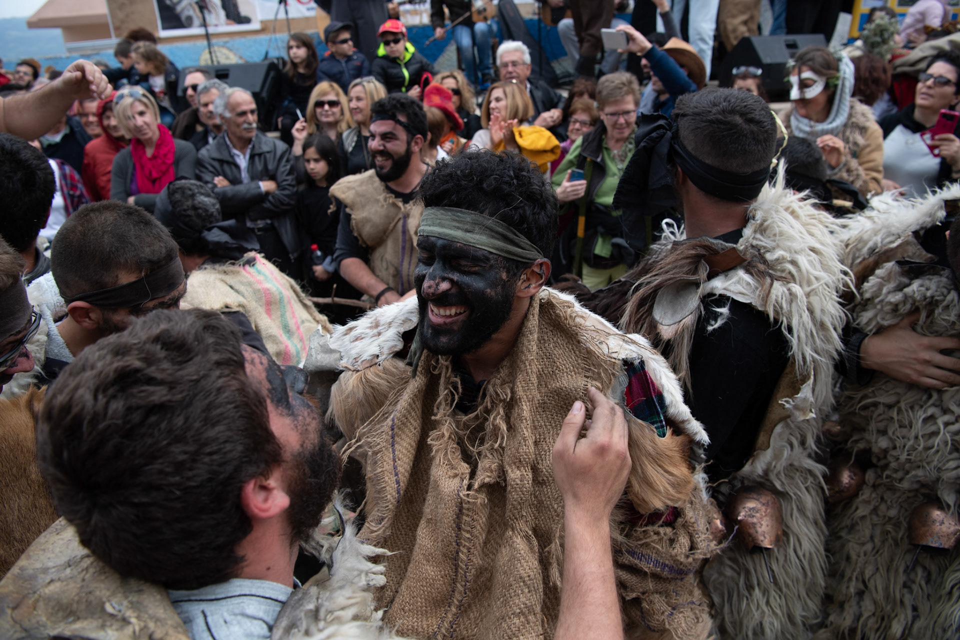 People dressed as sheep dance around, during the festivities of Clean Monday, in the village of Yeryeri, Crete, Greece, Monday, Feb. 27, 2017.