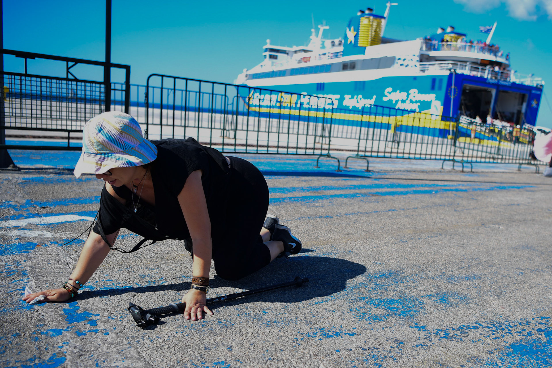 A pilgrim crawls her way to the Greek Orthodox Church of Panagia Evaggelistria during the Ascension of Virgin Mary holiday, in Tinos, Greece, Wednesday, Aug. 15, 2018.