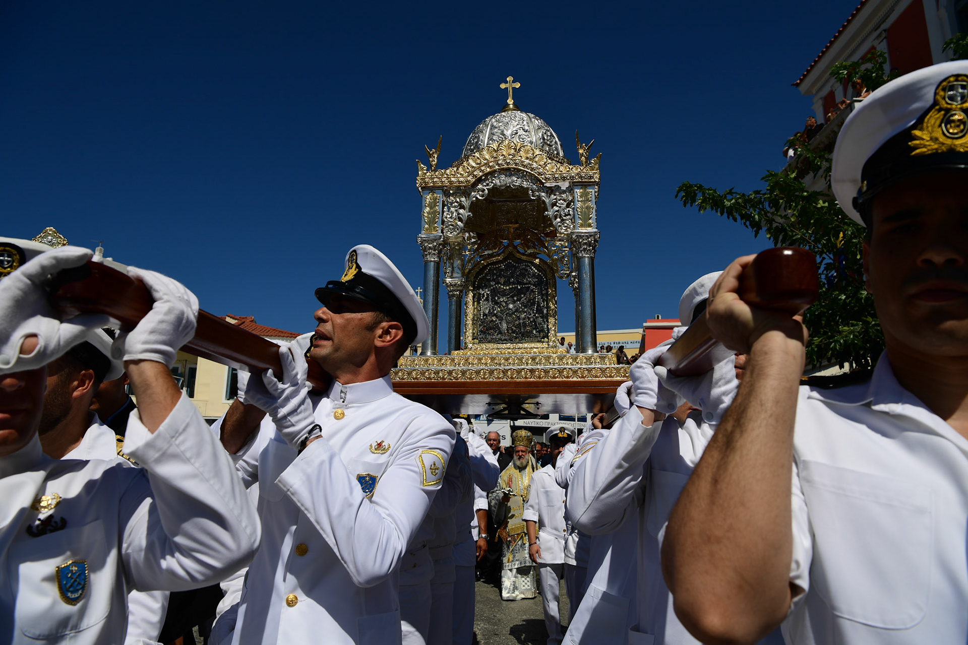 Officers of the Greek Navy carry the Holy Icon of Panagia during the Ascension of Virgin Mary holiday, in Tinos, Greece, Wednesday, Aug. 15, 2018.