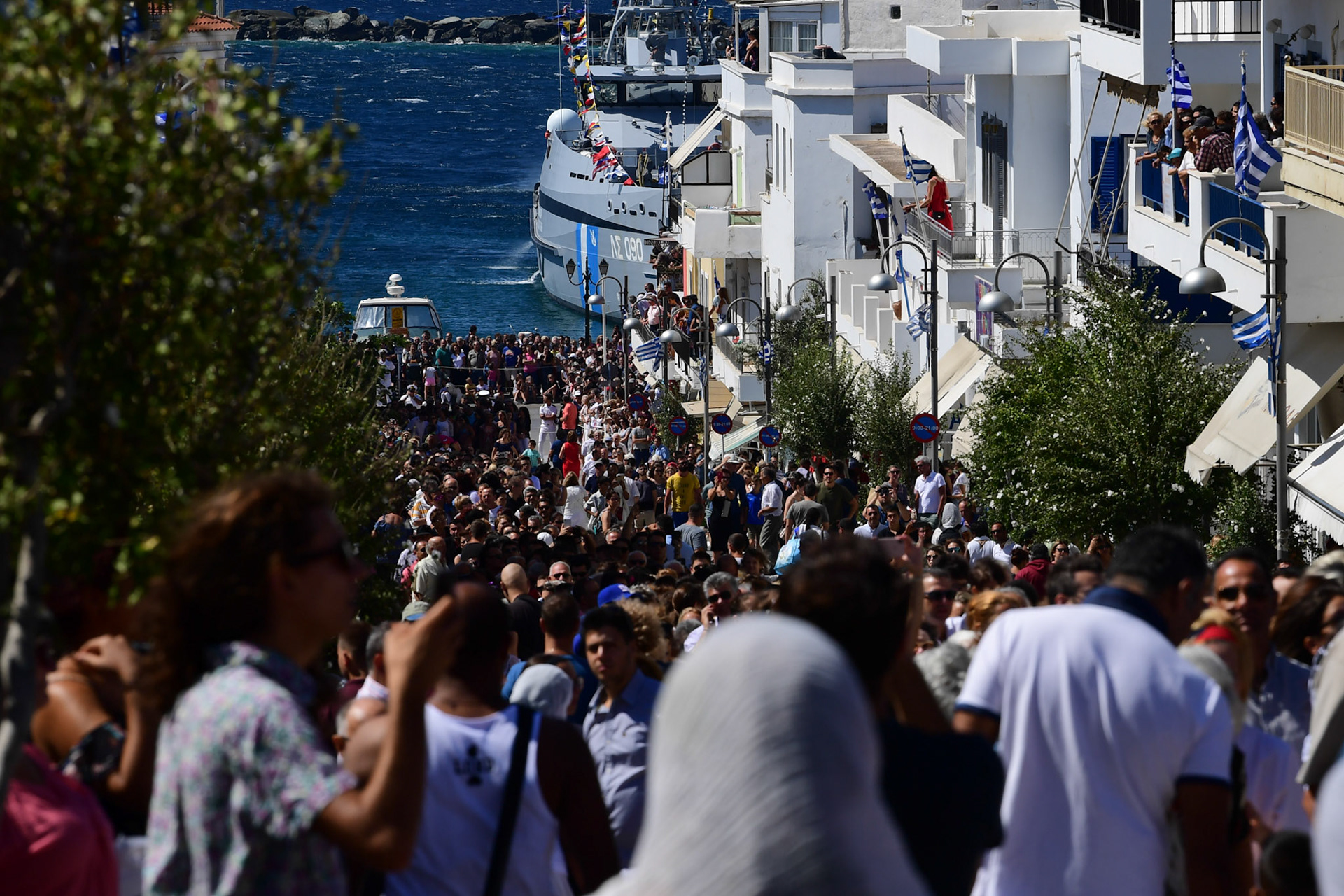 Pilgrims gather in the town of the Greek island of Tinos, during the Ascension of Virgin Mary holiday, Greece, Wednesday, Aug. 15, 2018.
