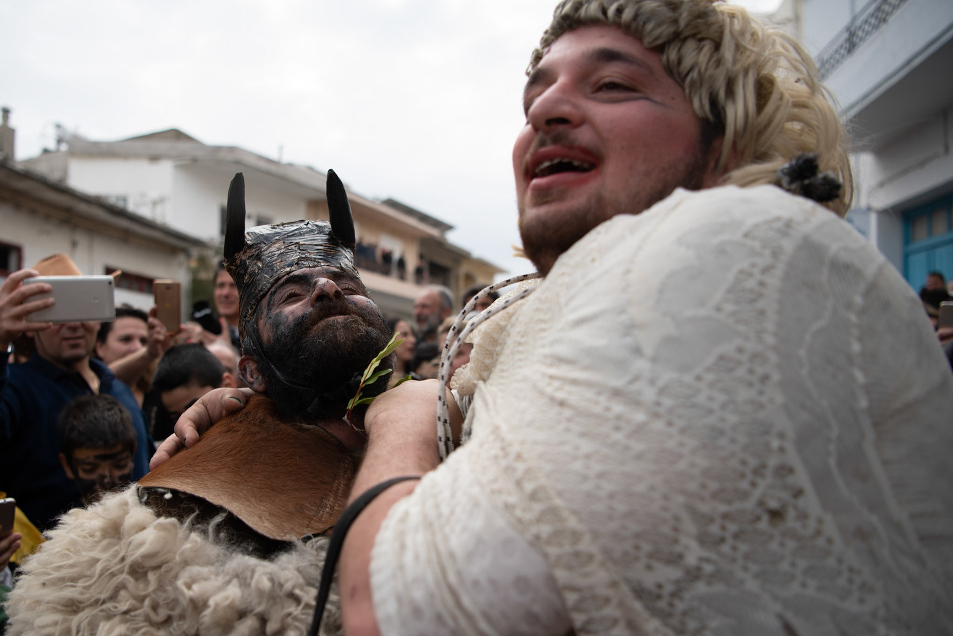 A man dressed as the “bride”, acts sexual acts with a man dressed as an ox, at the festivities of Clean Monday, in the village of Yeryeri, Crete, Greece, Monday, Feb. 27, 2017.