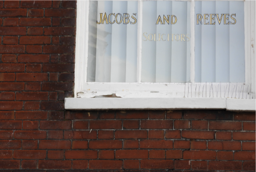 Chipped paintwork on the window frames and sills.