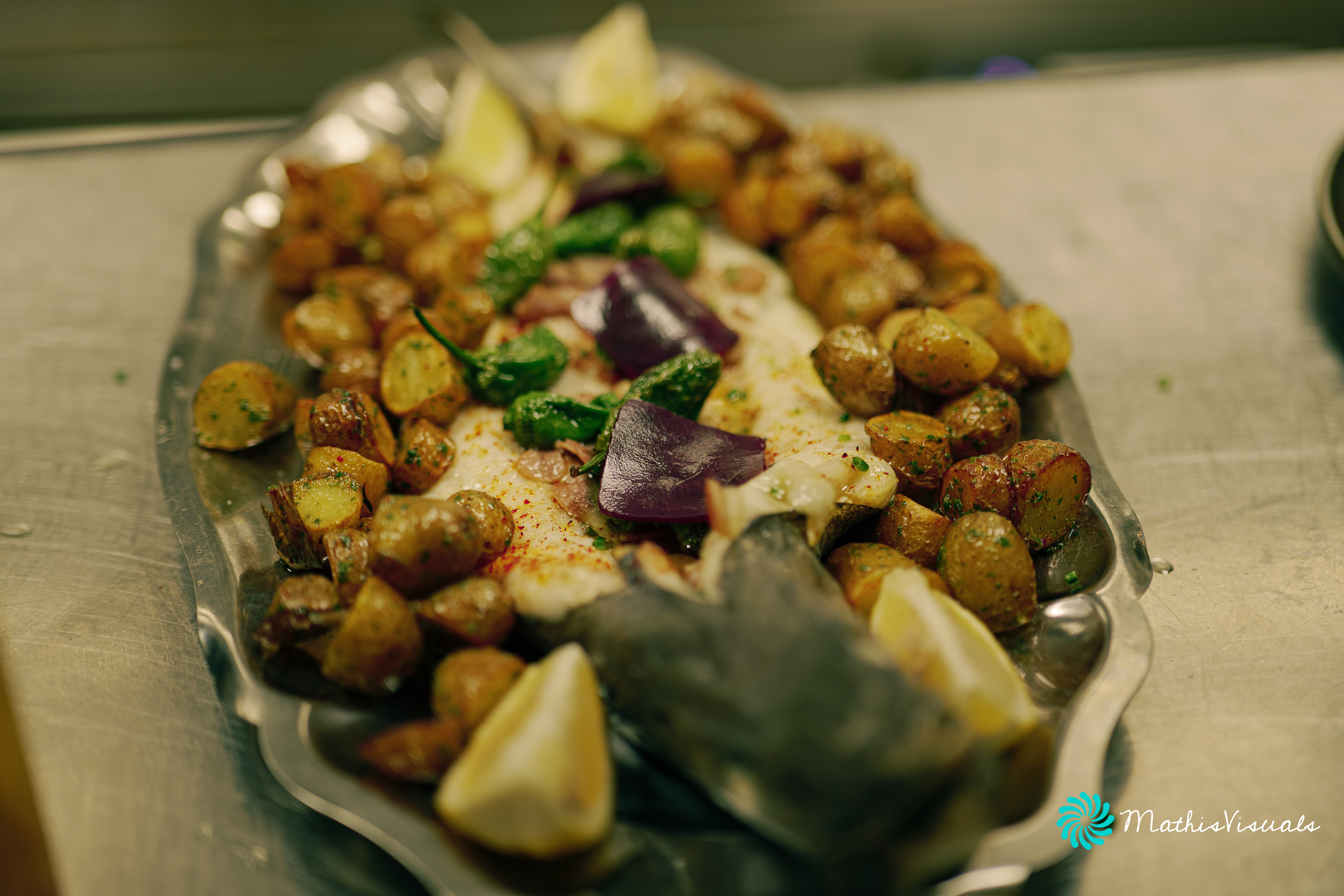 Spanish-style hake with grenailles