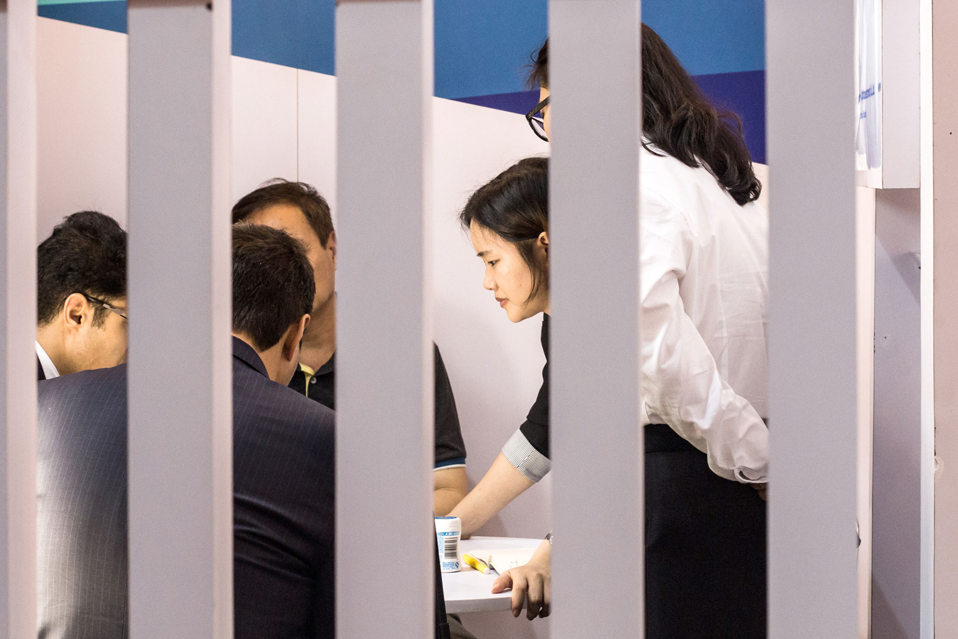 Saleswoman amid the closing of a deal - Guangzhou, China © Fotis Providas