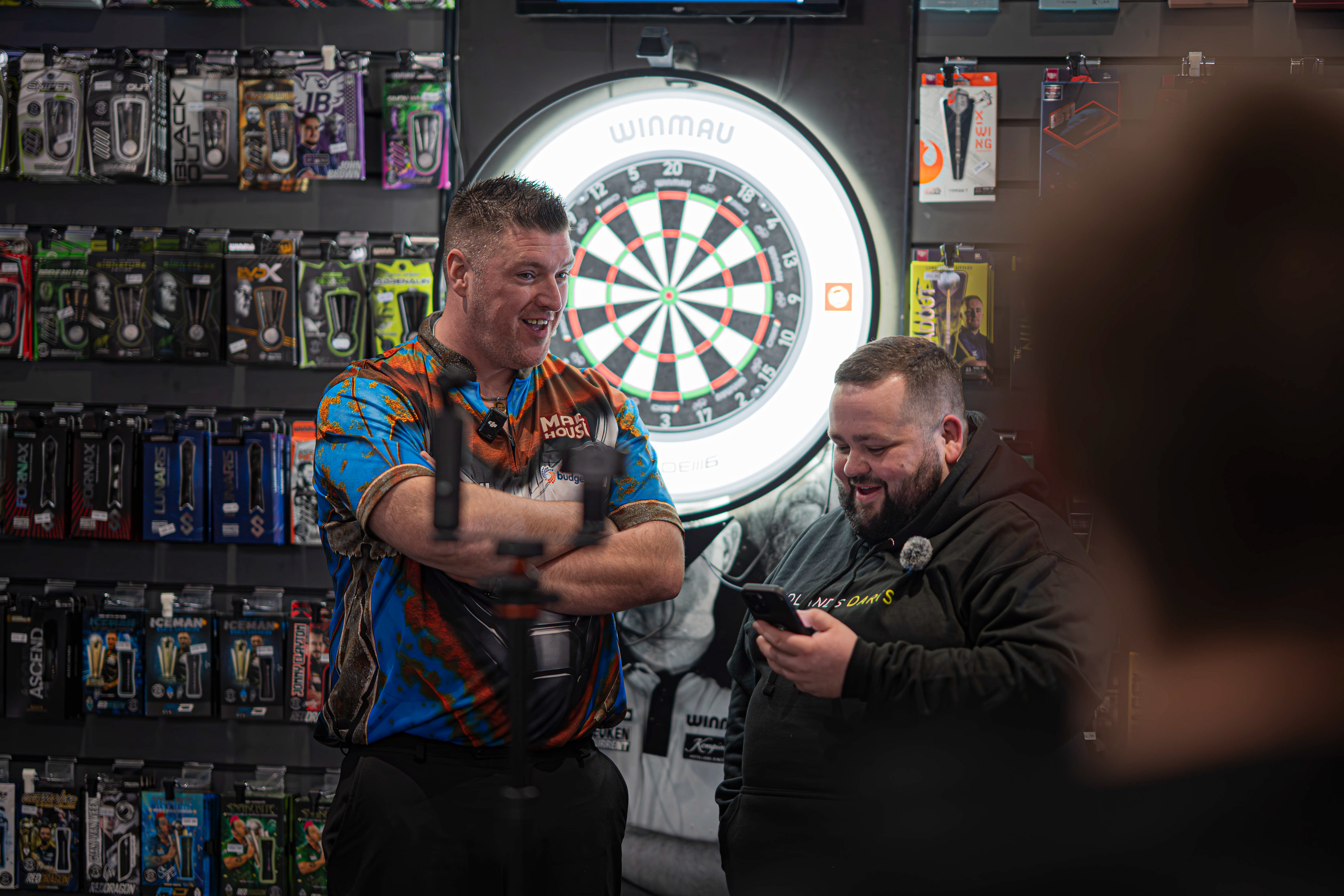 PDC pro Daryl Gurney being interviewed by Dom Mason for a TikTok video at Midlands Darts Shop, Tamworth, Staffordshire. 1st March 2026