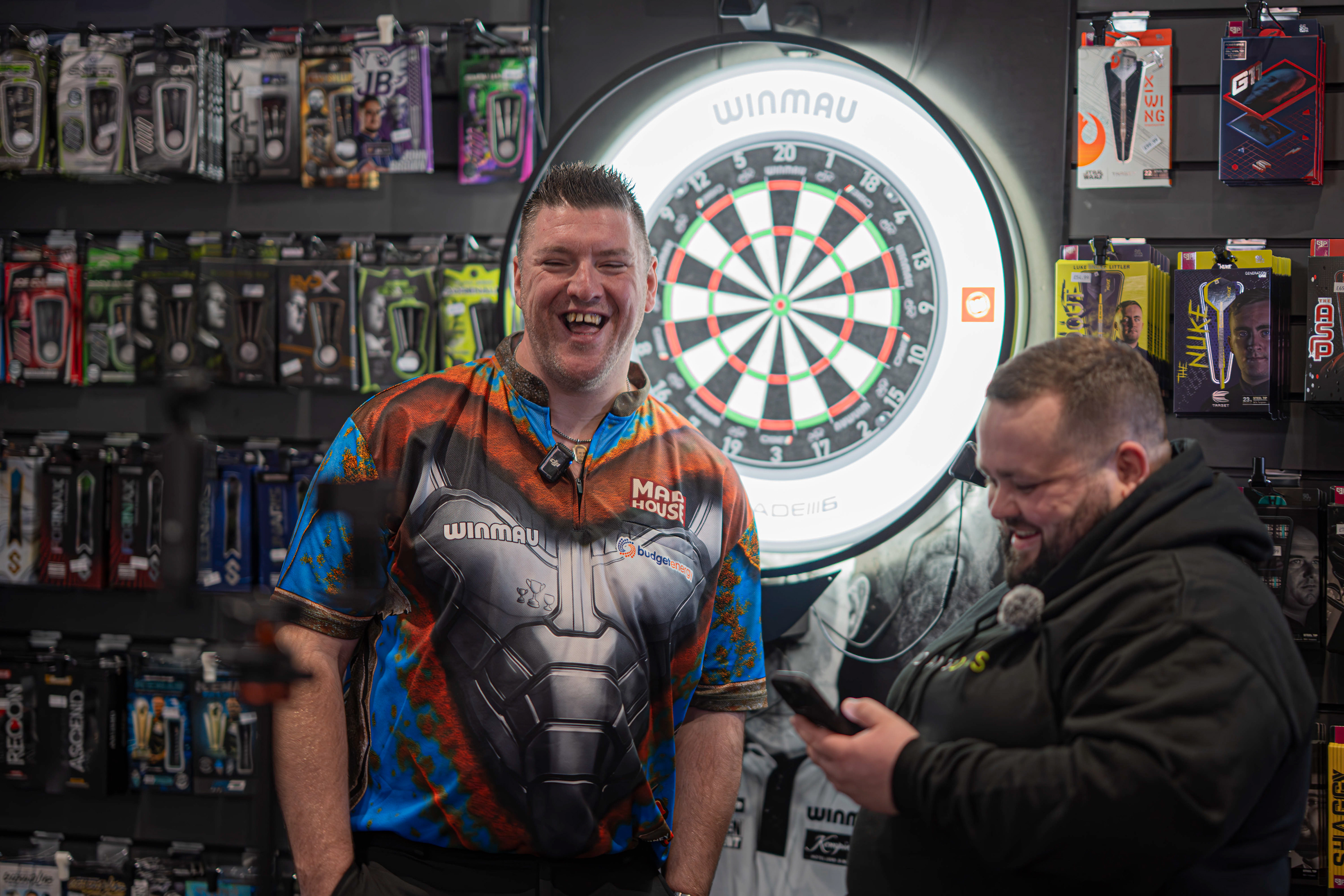 PDC pro Daryl Gurney being interviewed by Dom Mason for a TikTok video at Midlands Darts Shop, Tamworth, Staffordshire. 1st March 2026