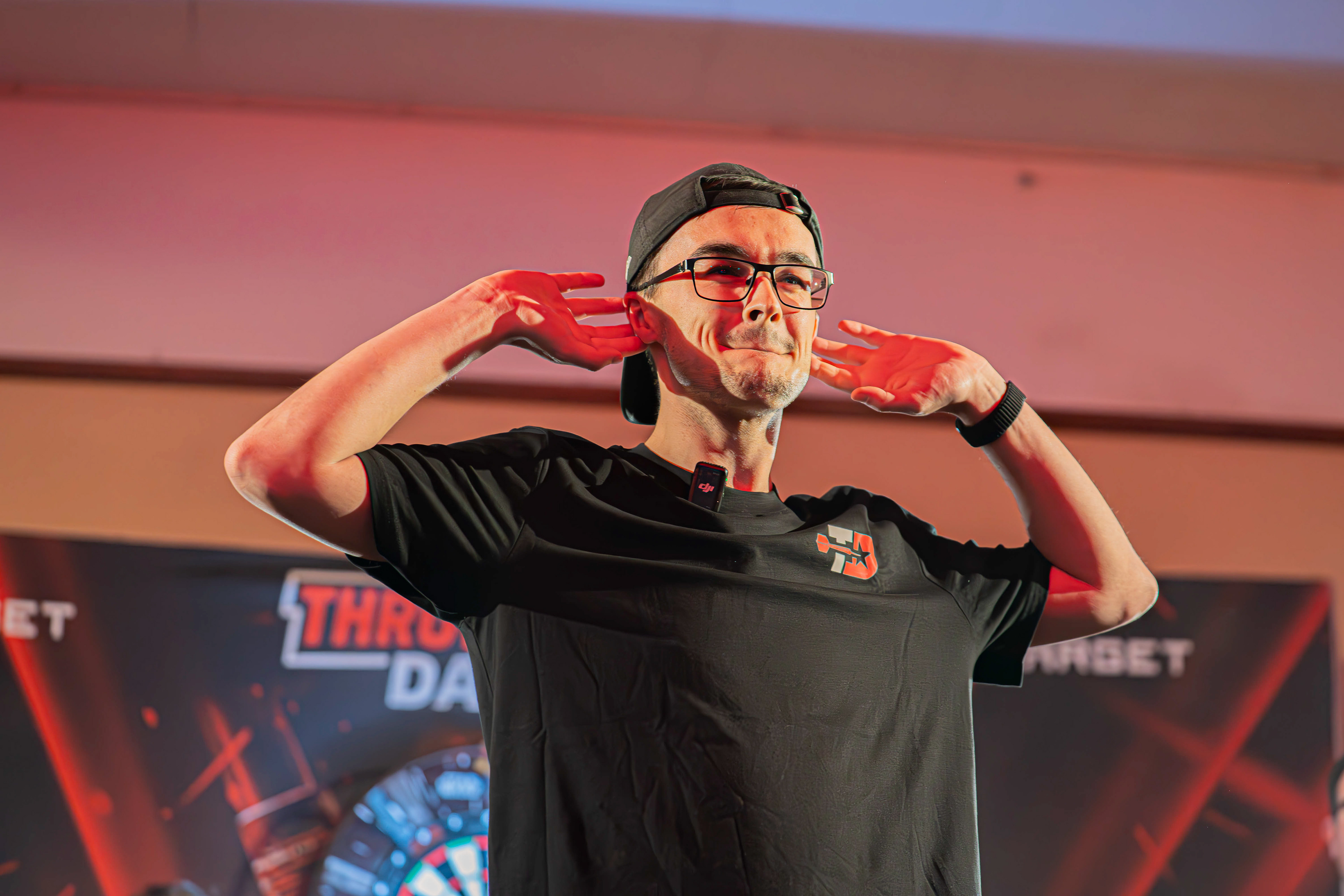 Sam Jackson engaging with the crowd as he makes this Throwdown Darts debut at the Copthorne Hotel, Brierley Hill. 27/03/26