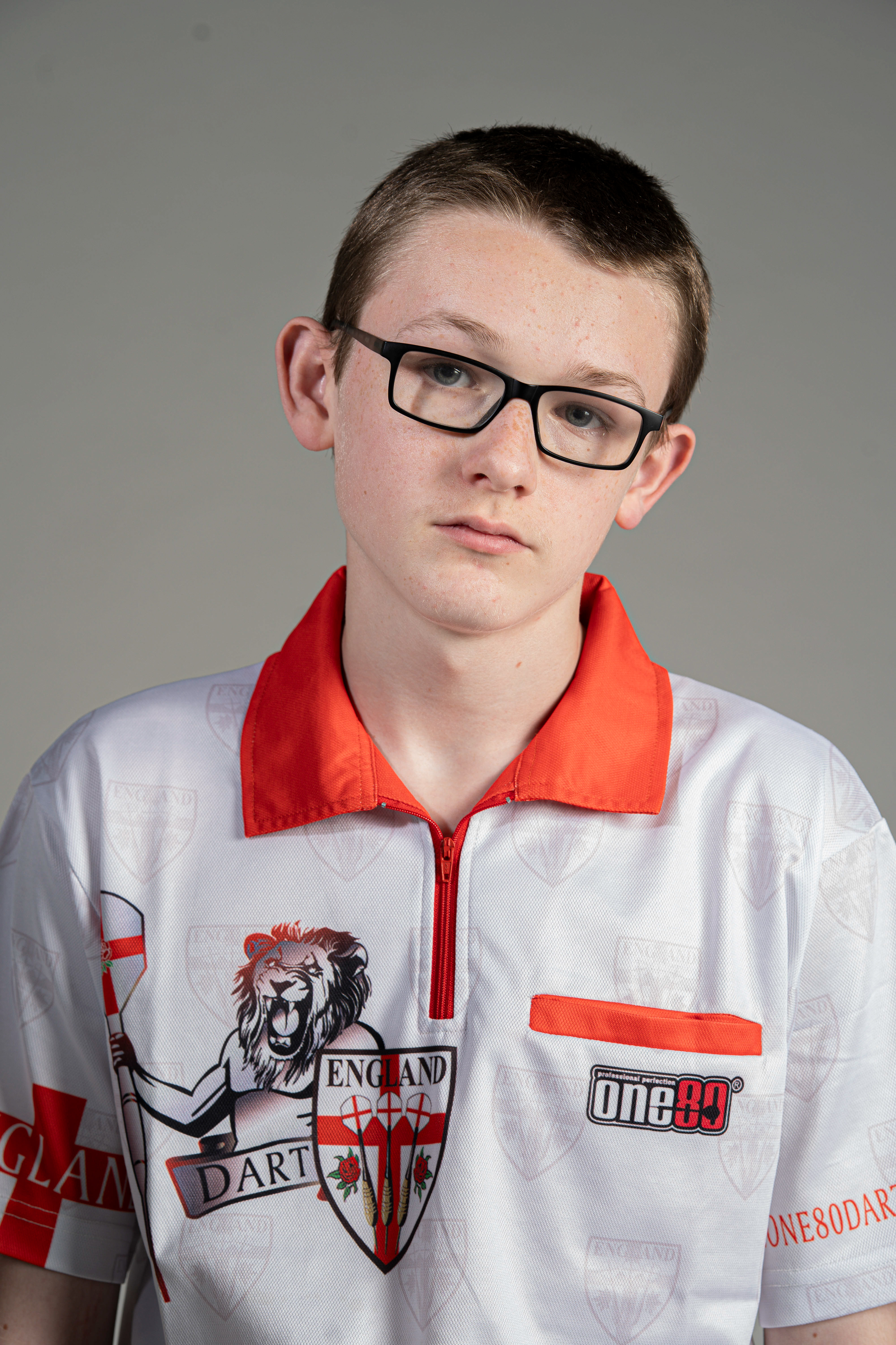15-year-old darting wonderkid, Jack Nankervis, wearing his most recent playing shirt for when he represents England, in Studio 3 at Falmouth University. 14th April 2026