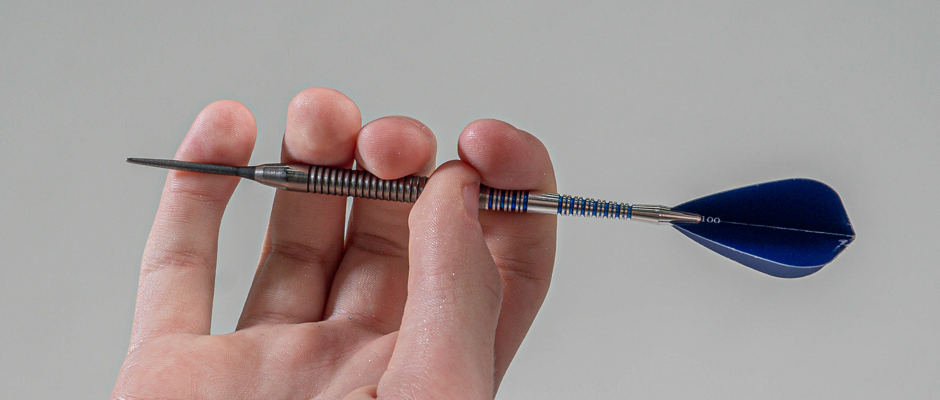 A close up of 15-year-old darting wonderkid, Jack Nankervis’ grip on his dart, in Studio 3 at Falmouth University. 14th April 2026