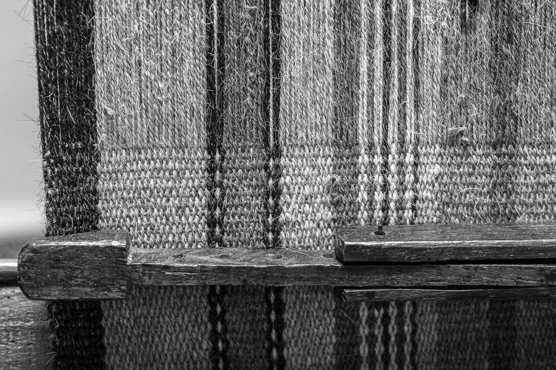 Stretching the fabric in the process of weaving