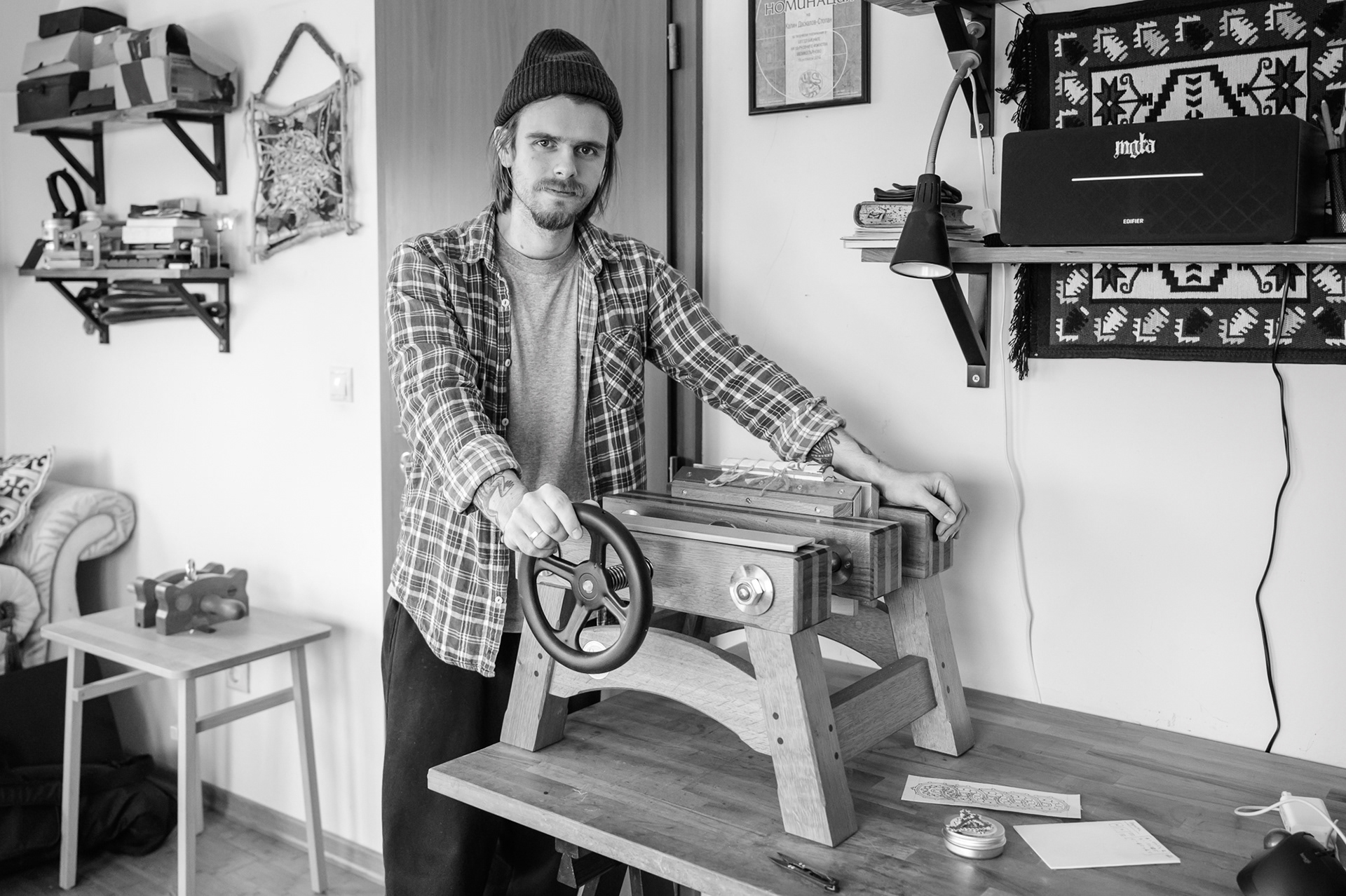 Stopan with his book press which he uses for edge trimming, or crimping when drying