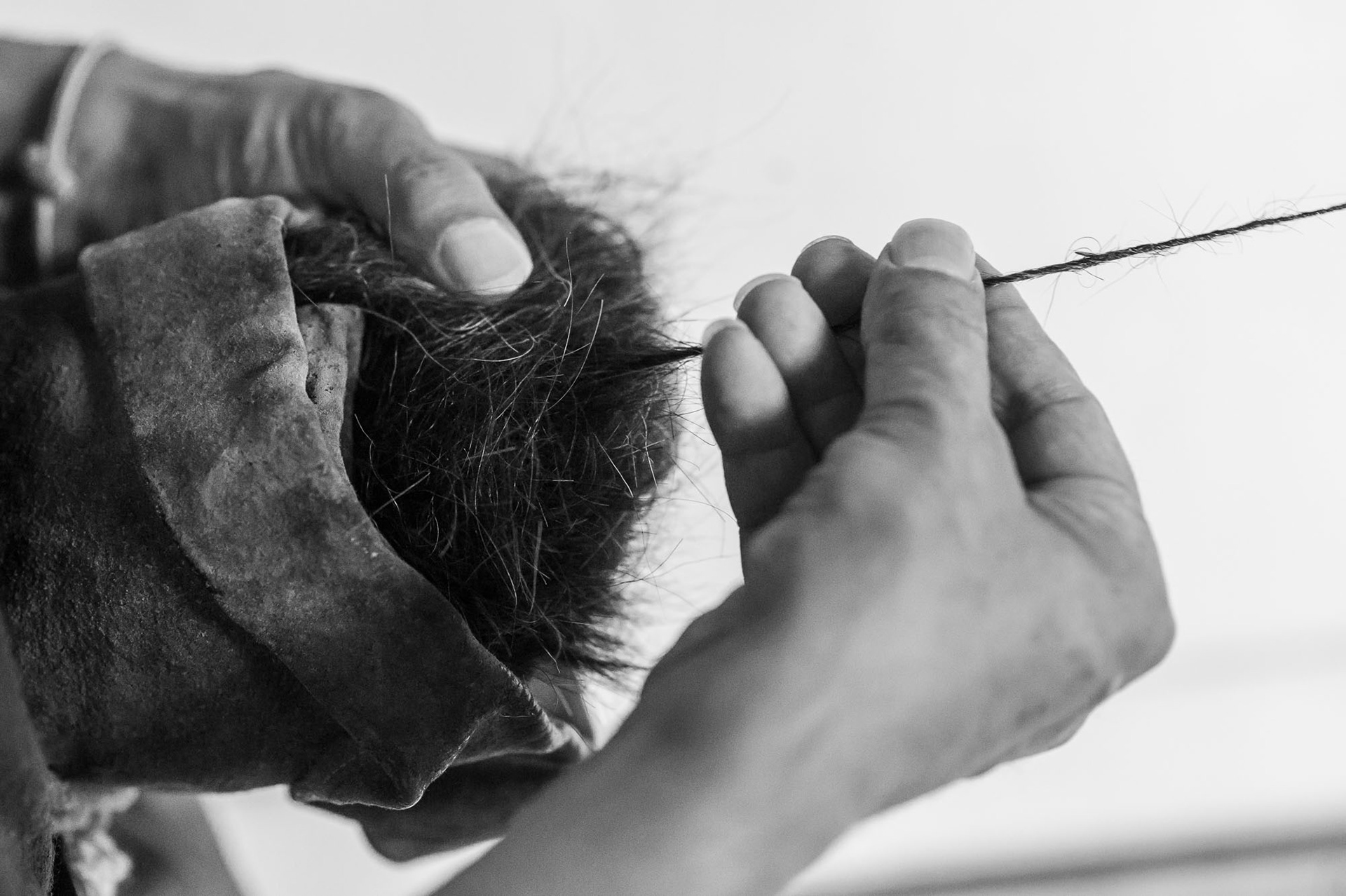 Spinning is the pulling of a thin, increasingly long thread into a wick that is twisted