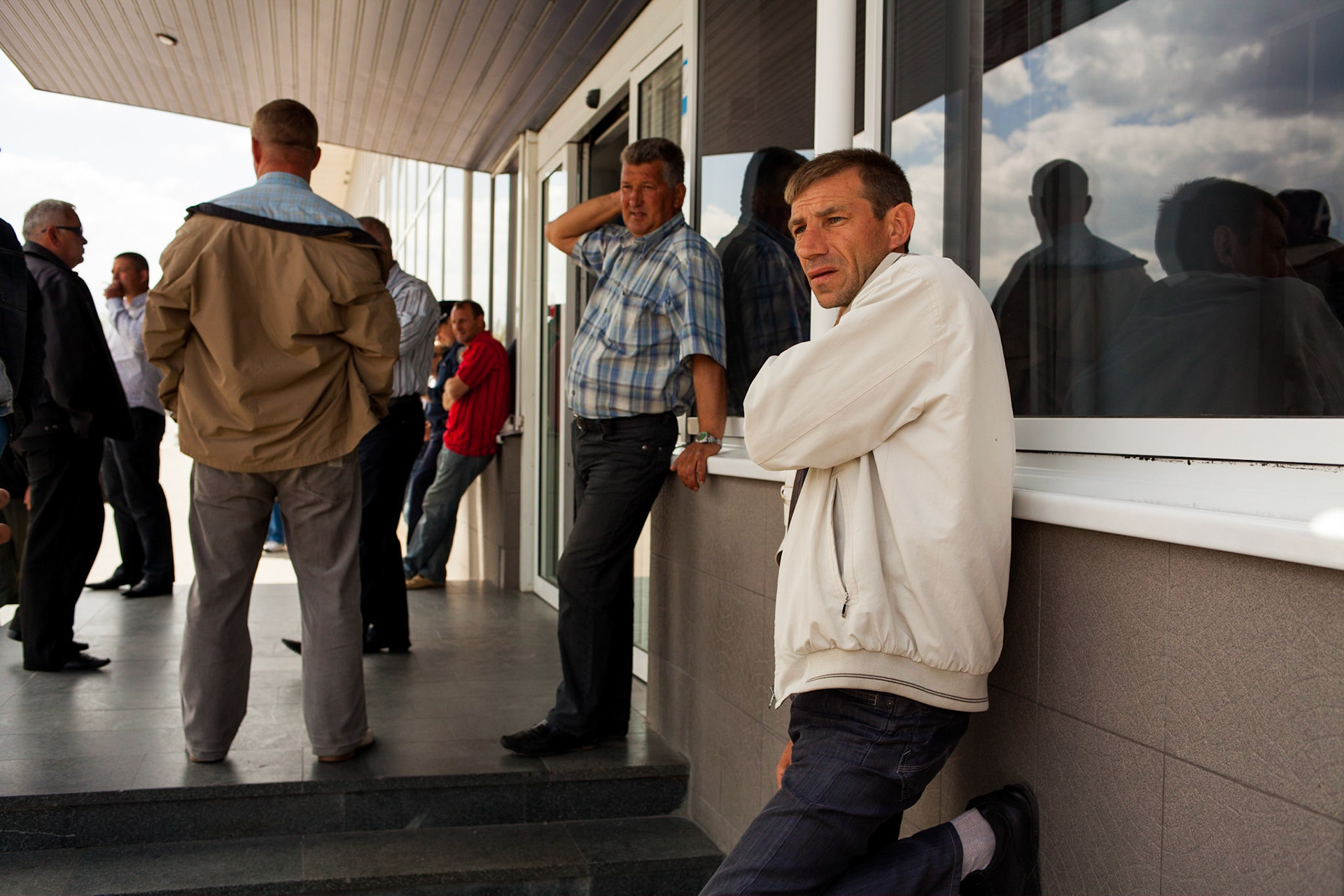 The Ukrainian crowd waiting for the plane. A journey through the eyes of Frederic Leonard, a head hunter for "new faces", who scouts fresh young Eastern girls who are to become fashion models. Kiev, Ukraine.