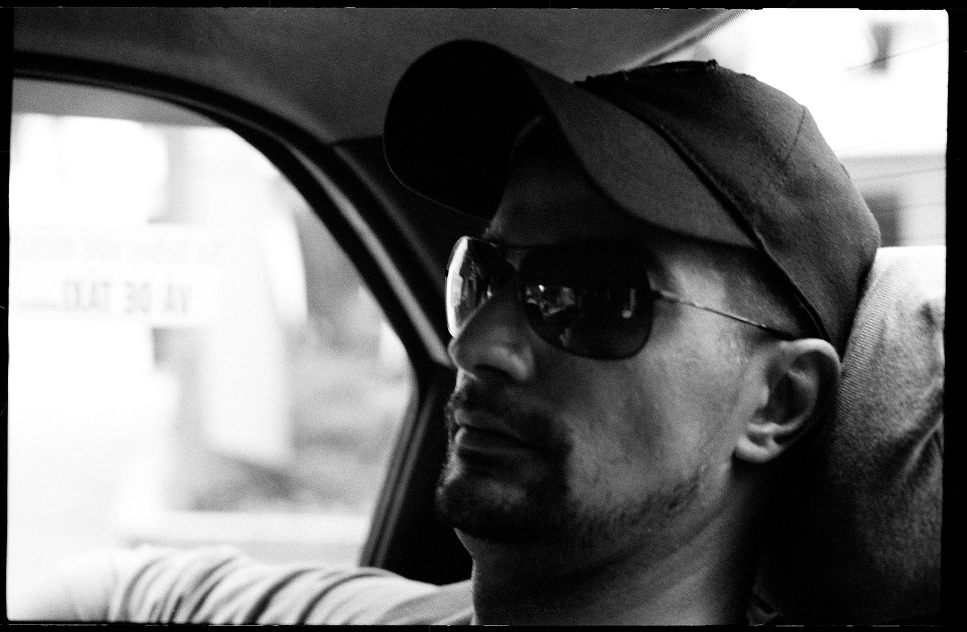 Vitor in the taxi in Sao Paulo, going to meet Ming, an local scout. Brazil, june 2008.