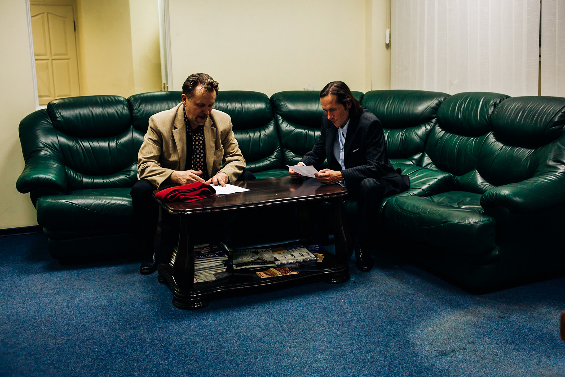 Frederic Leonard, the scout and young model hunter, with Alexander, his local help, in the office of a local manager in Kiev.