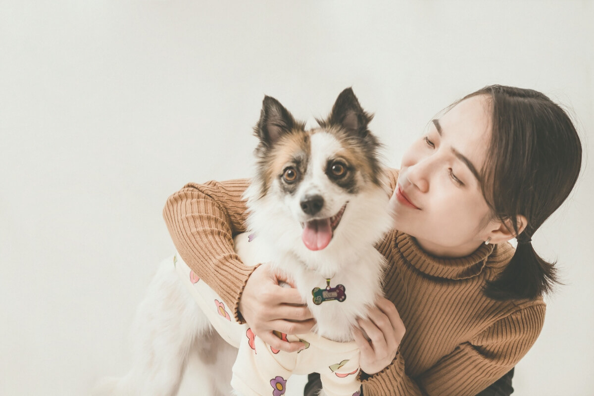 Photo of a woman caring for a small dog