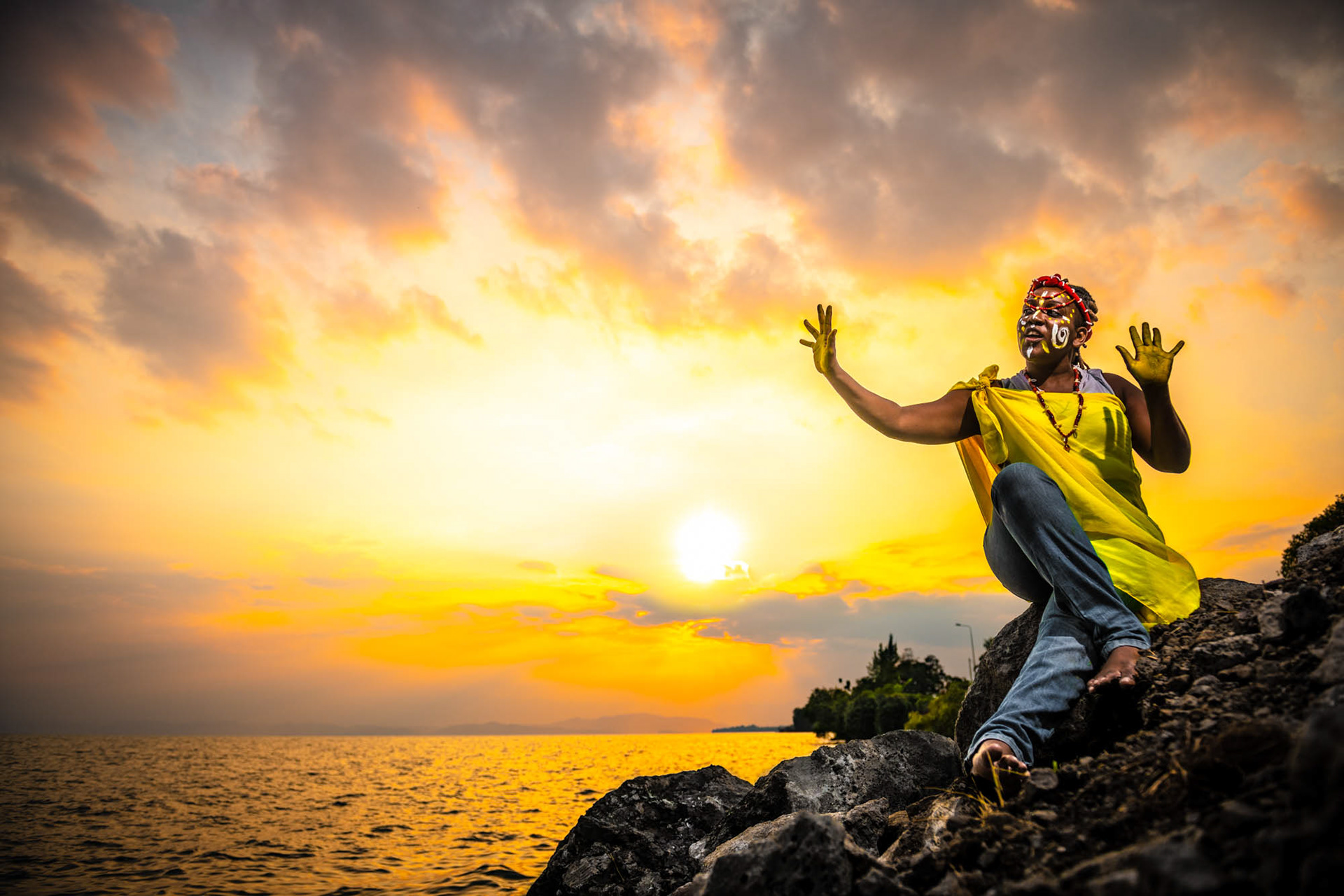 Congolese women rights activist performing by Lake Kivu in Goma DRC