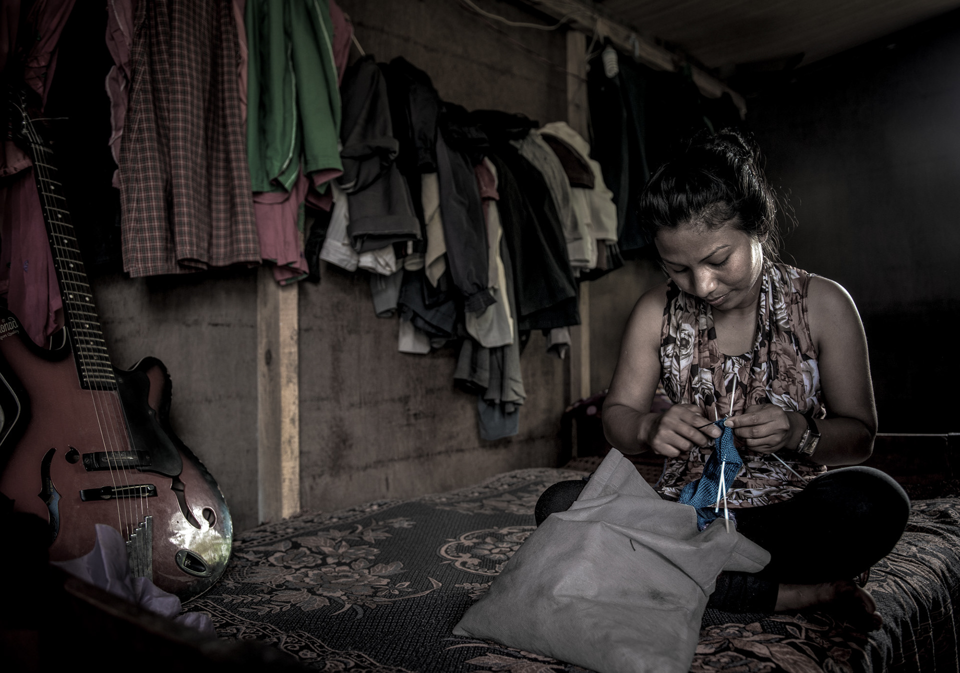 Dinadi artisan knitting Dinadi Products in her home - in Kathmandu, Nepal