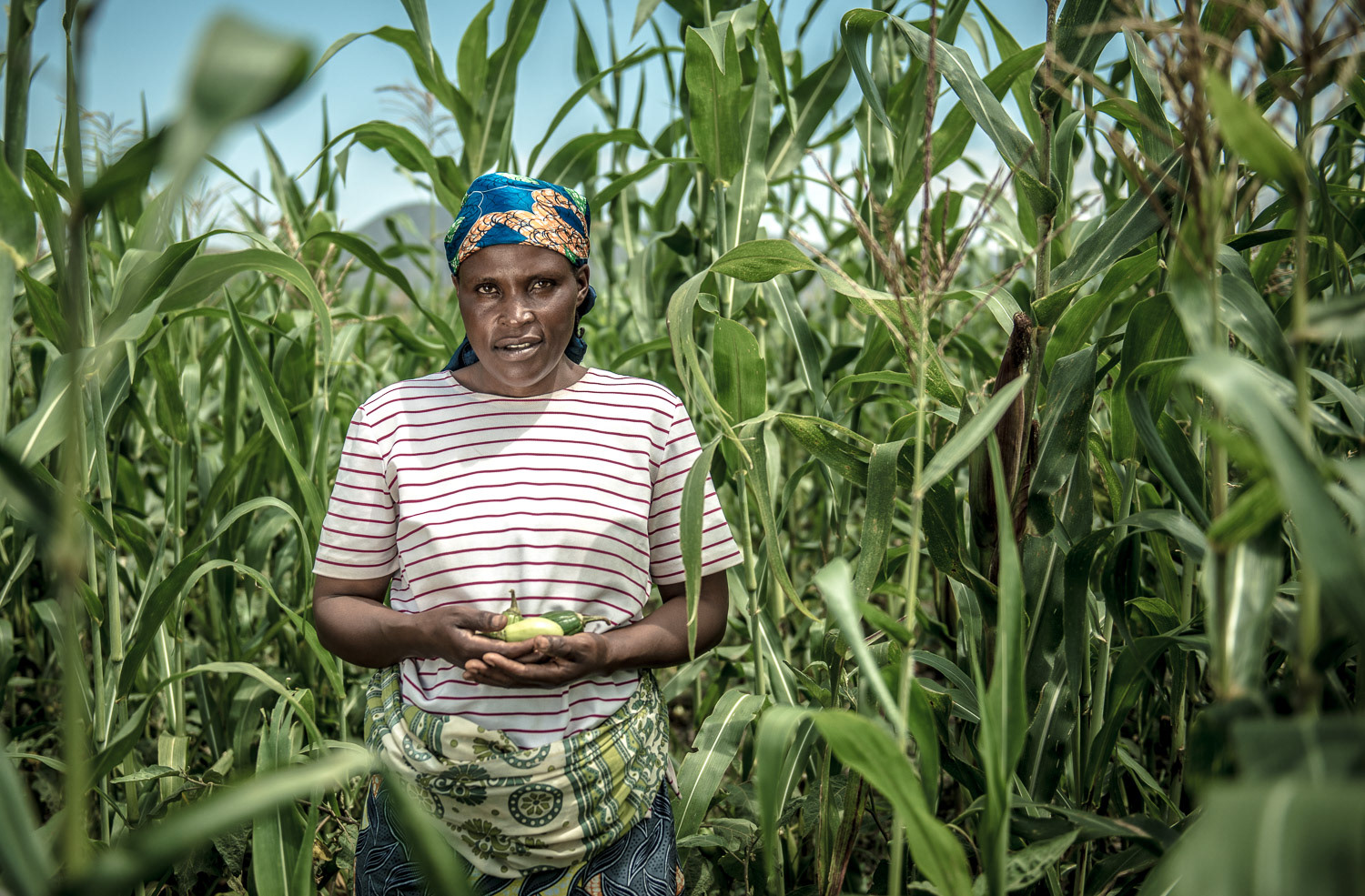 Showing the produce from her farm - - On assignment with Women for Women International in the Democratic Republic of Congo.