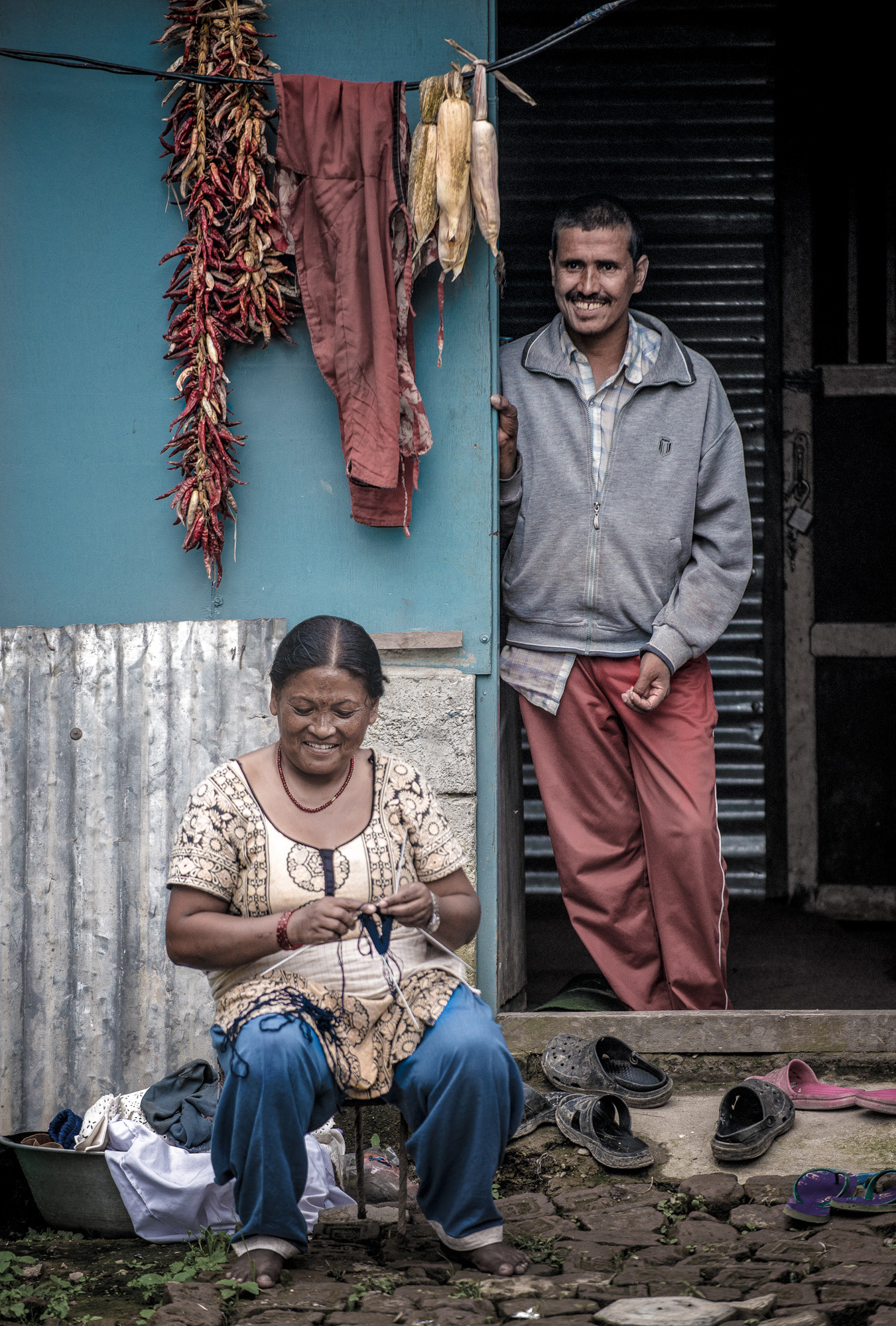 Dinadi artisan knitting Dinadi Products in her home - in Kathmandu, Nepal