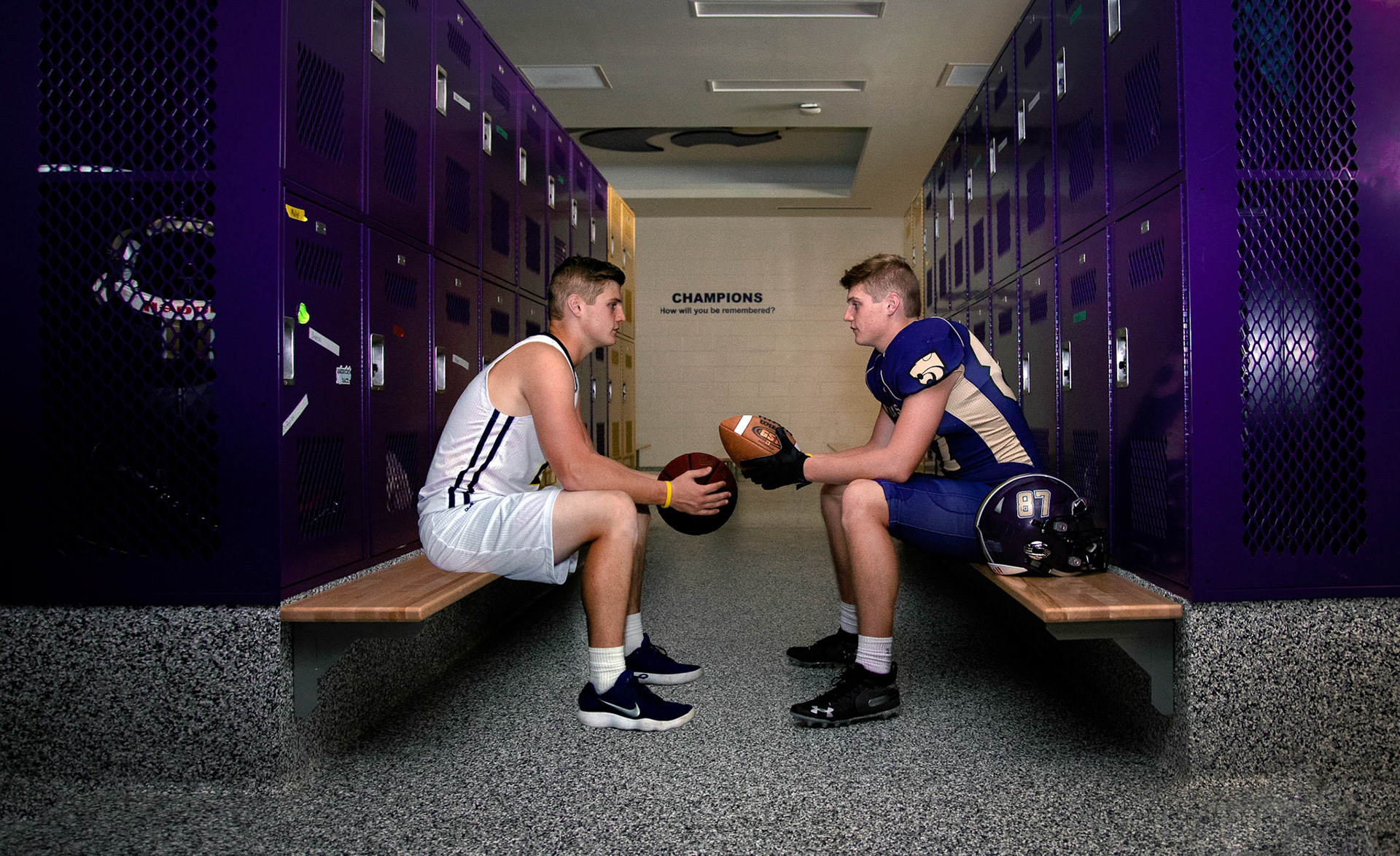 high school senior guy dual sport basketball and football in locker room