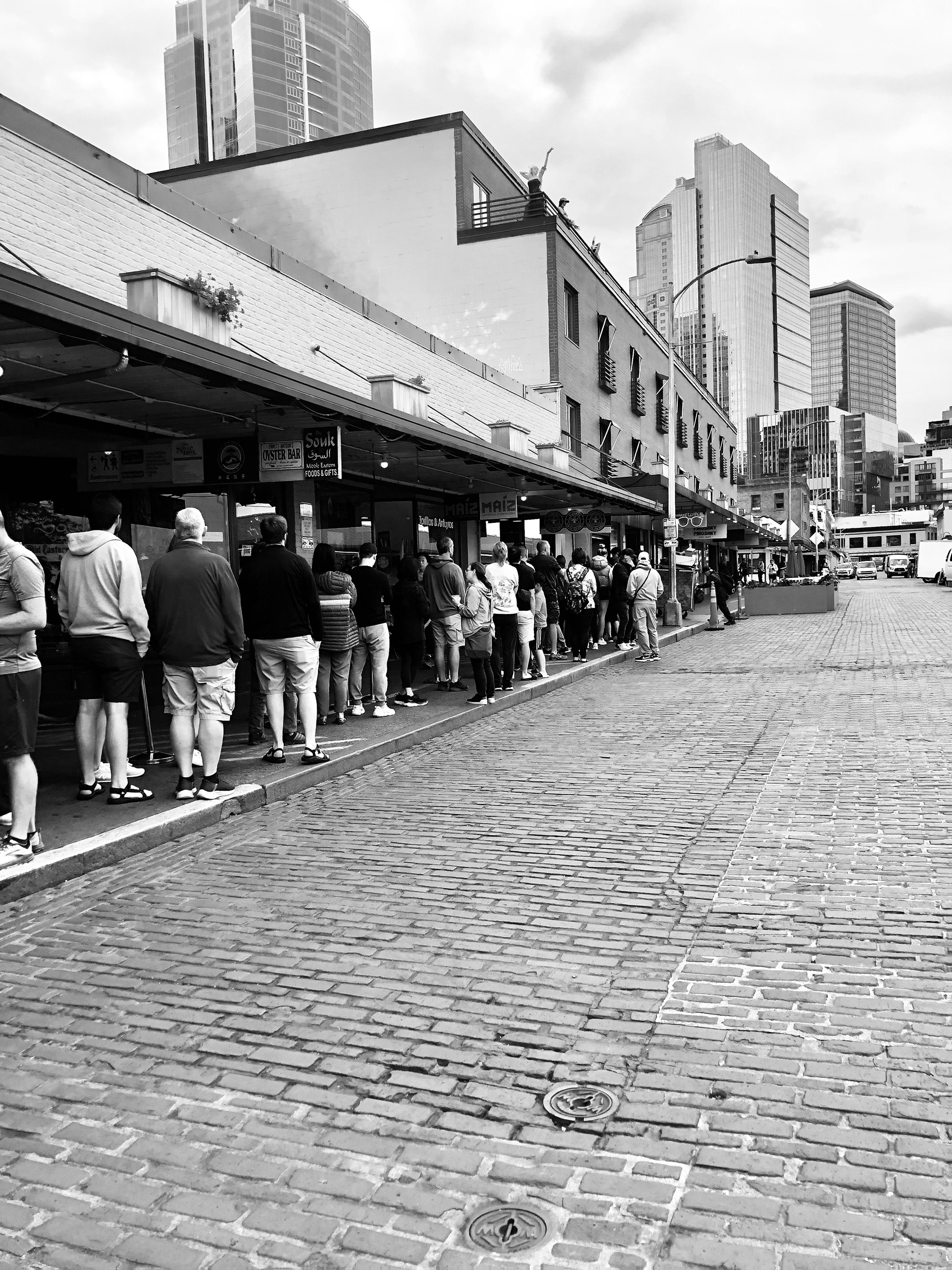 Waiting for Starbucks in Seattle, Pike Place, in black and white