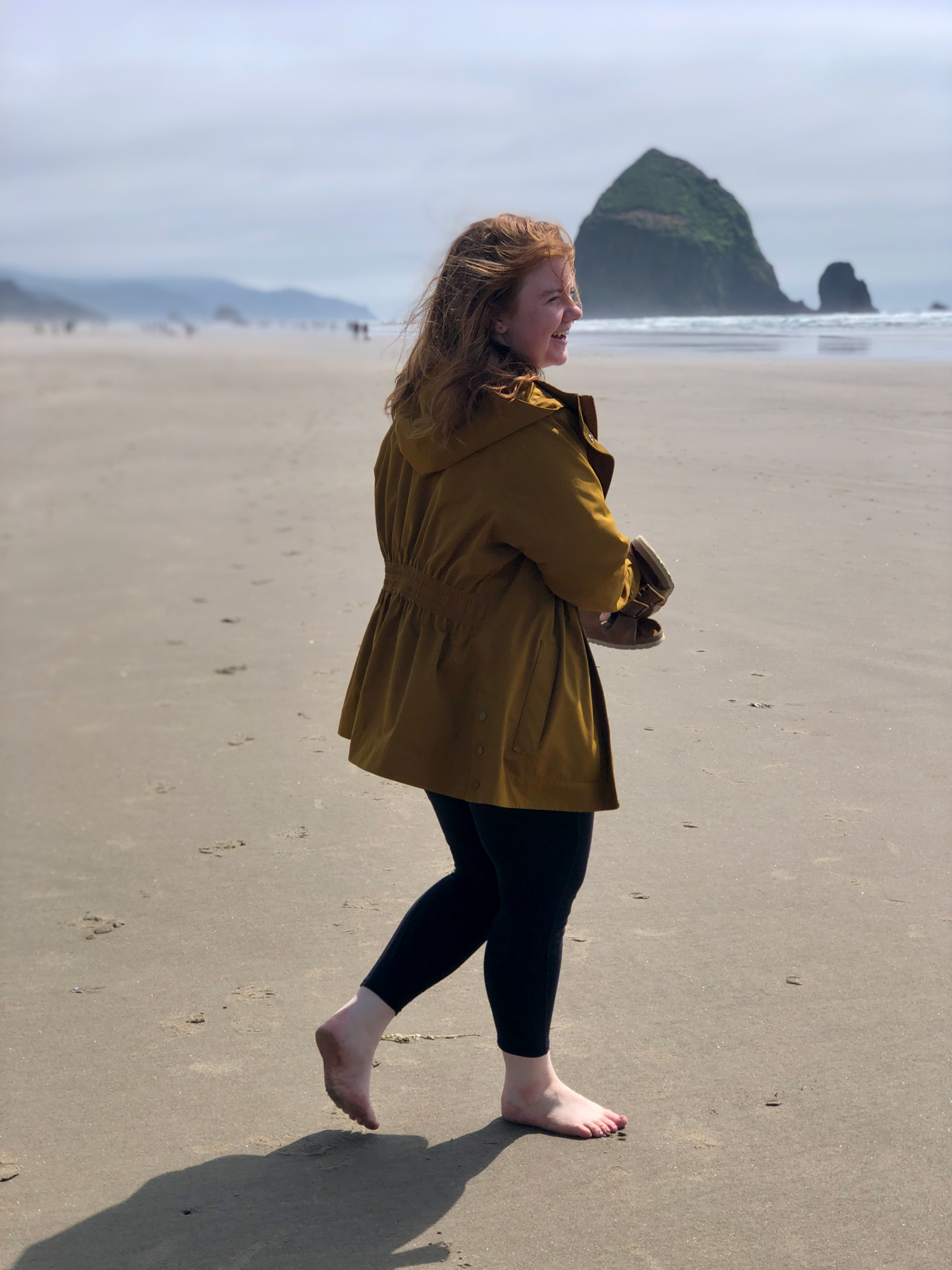 Woman walking on Cannon Beach