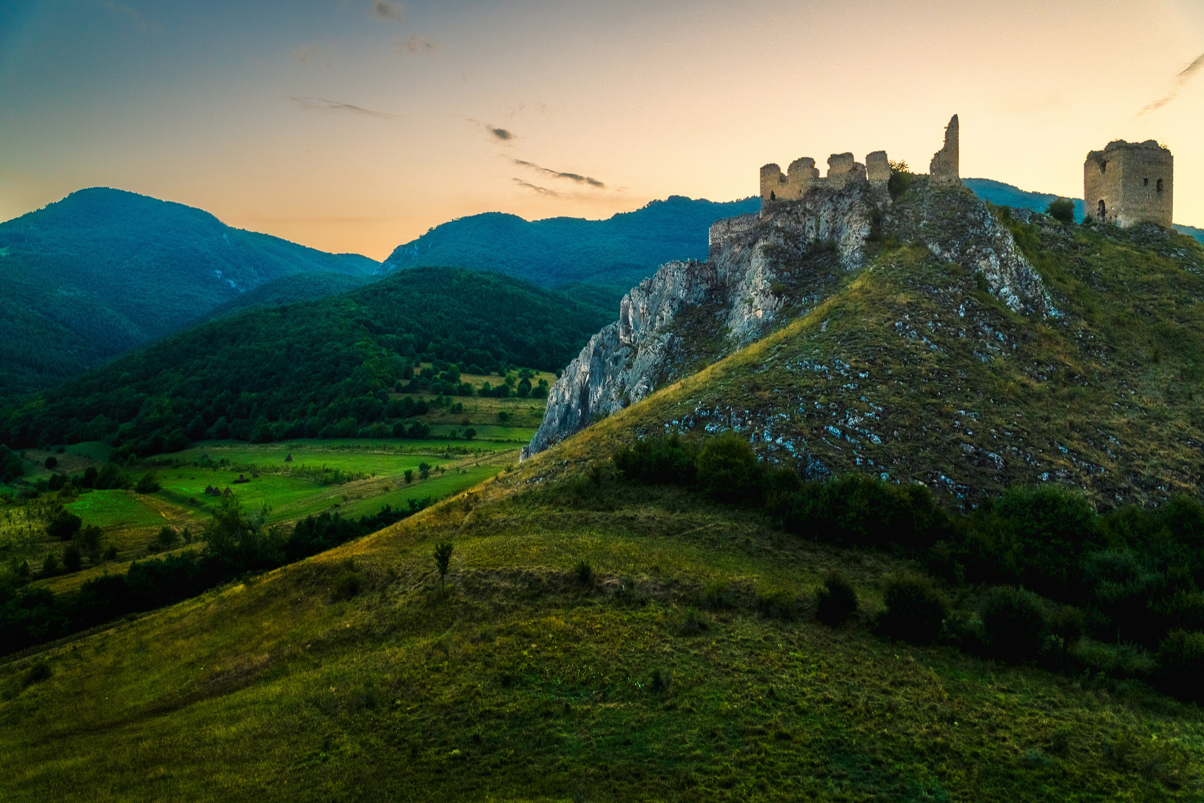 Sunset over a medieval castle in Transylvania.