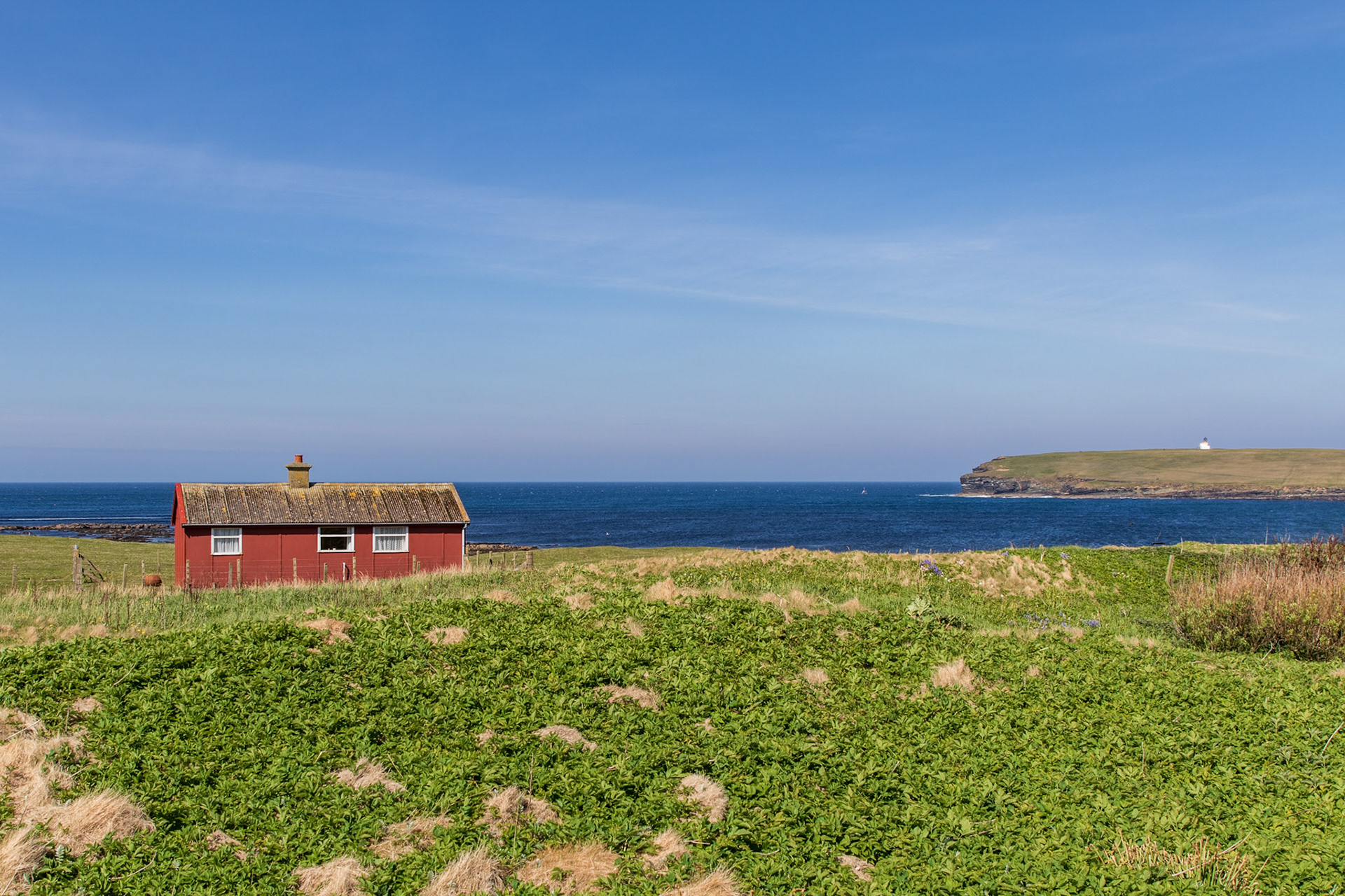 A red shed sits alone by the bay. In the distance, the single unmanned Brough of Birsay Lighthouse keeps watch. ⚓️🕯
. . .
Red Shed by the Bay
Birsay, Orkney
May 16, 2019

#shed #birsay #orkney #scotland #travel #tauck #travelphotography