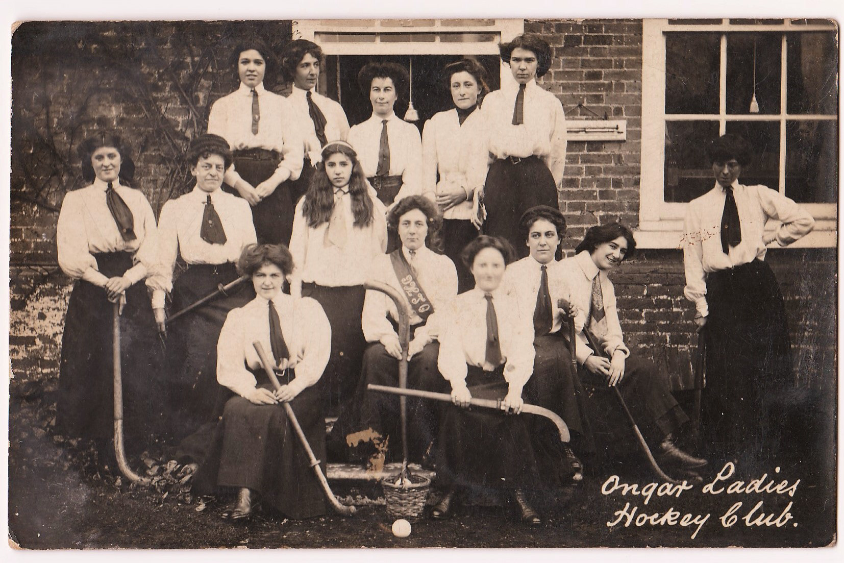 Ongar Ladies Hockey Club by F J Mott. Written on the back is 'Middle row, second from left is Miss Blanche Foster'
