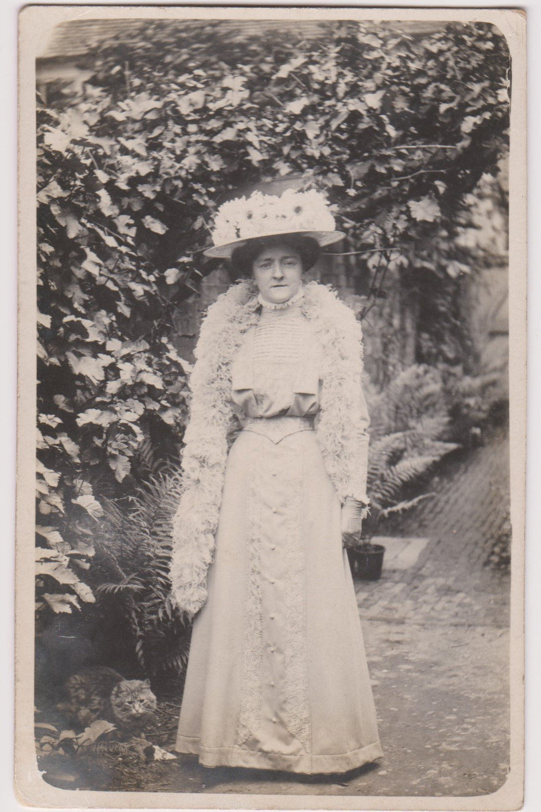 This may be Mrs Mott, the card was produced by F J Mott of Ongar