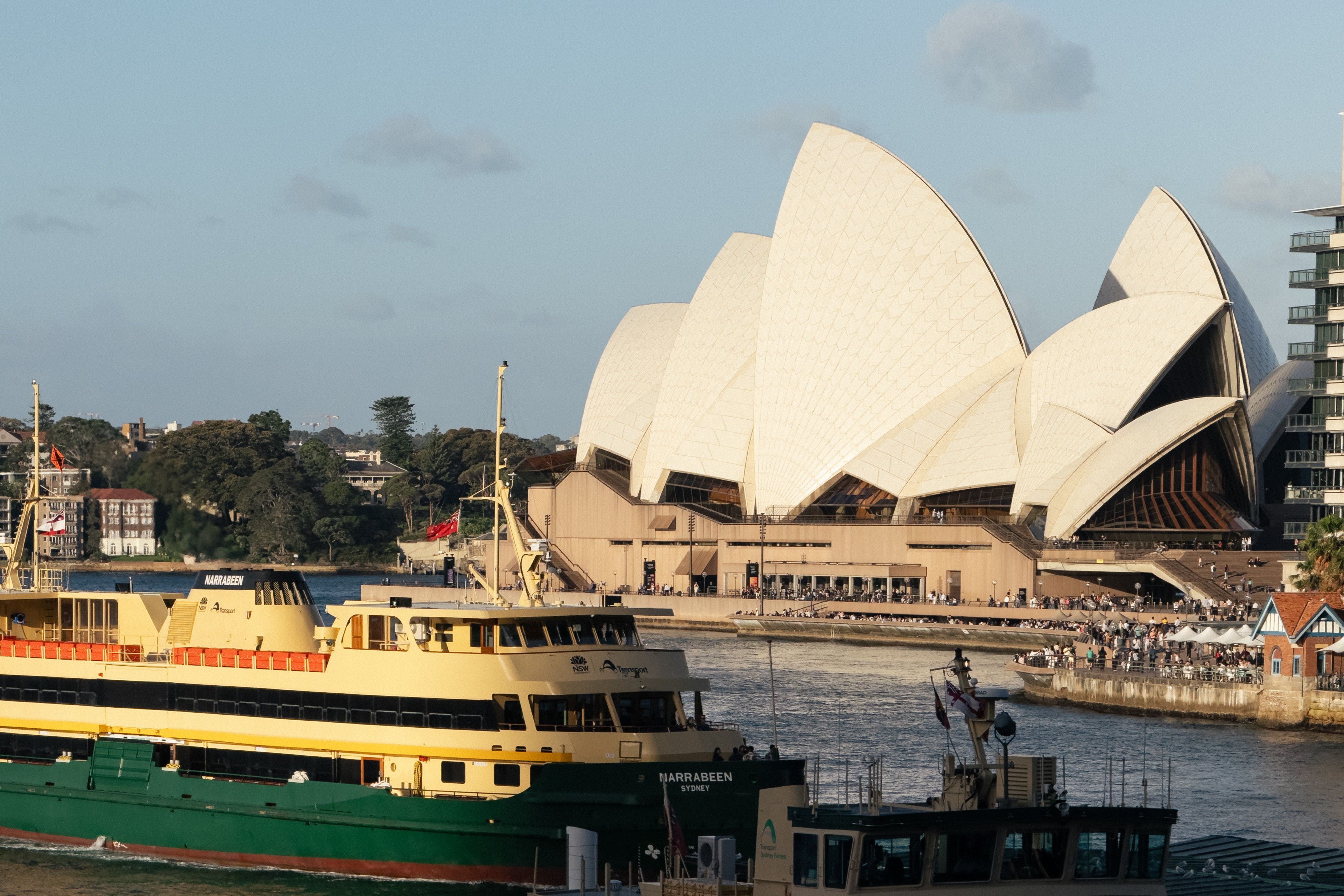 The most famous icon in Sydney is the Opera House. It's visible at every turn with a different perspective. This one is from atop the Circular Quay metro station. Also, one may take those green-yellow ferries to visit many tourist attractions nearby.