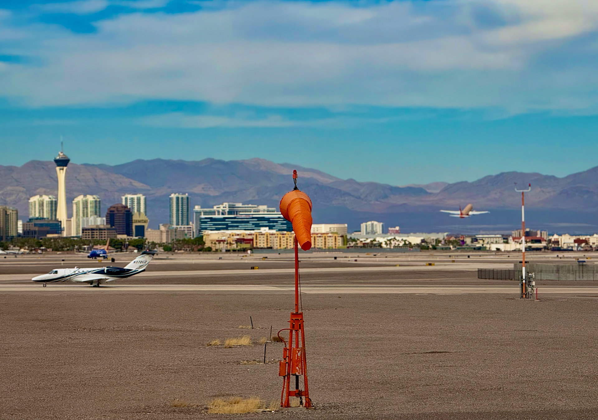 Las Vegas is situated next to a mountain, which itself is next to a desert.
