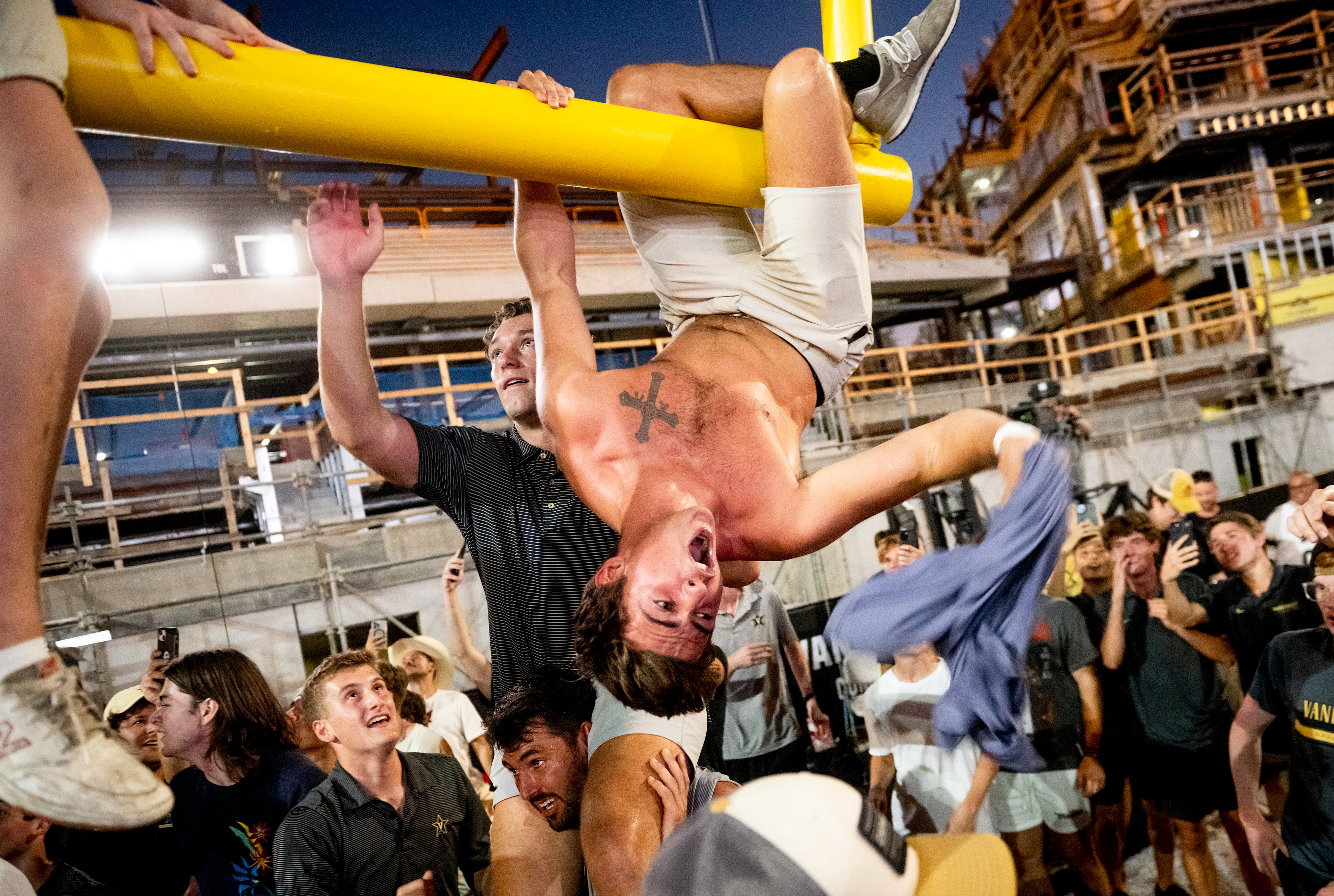 Fans bring the goal post down after Vanderbilt defeated Alabama 40-35 at FirstBank Stadium in Nashville, Tenn., Saturday, Oct. 5, 2024.