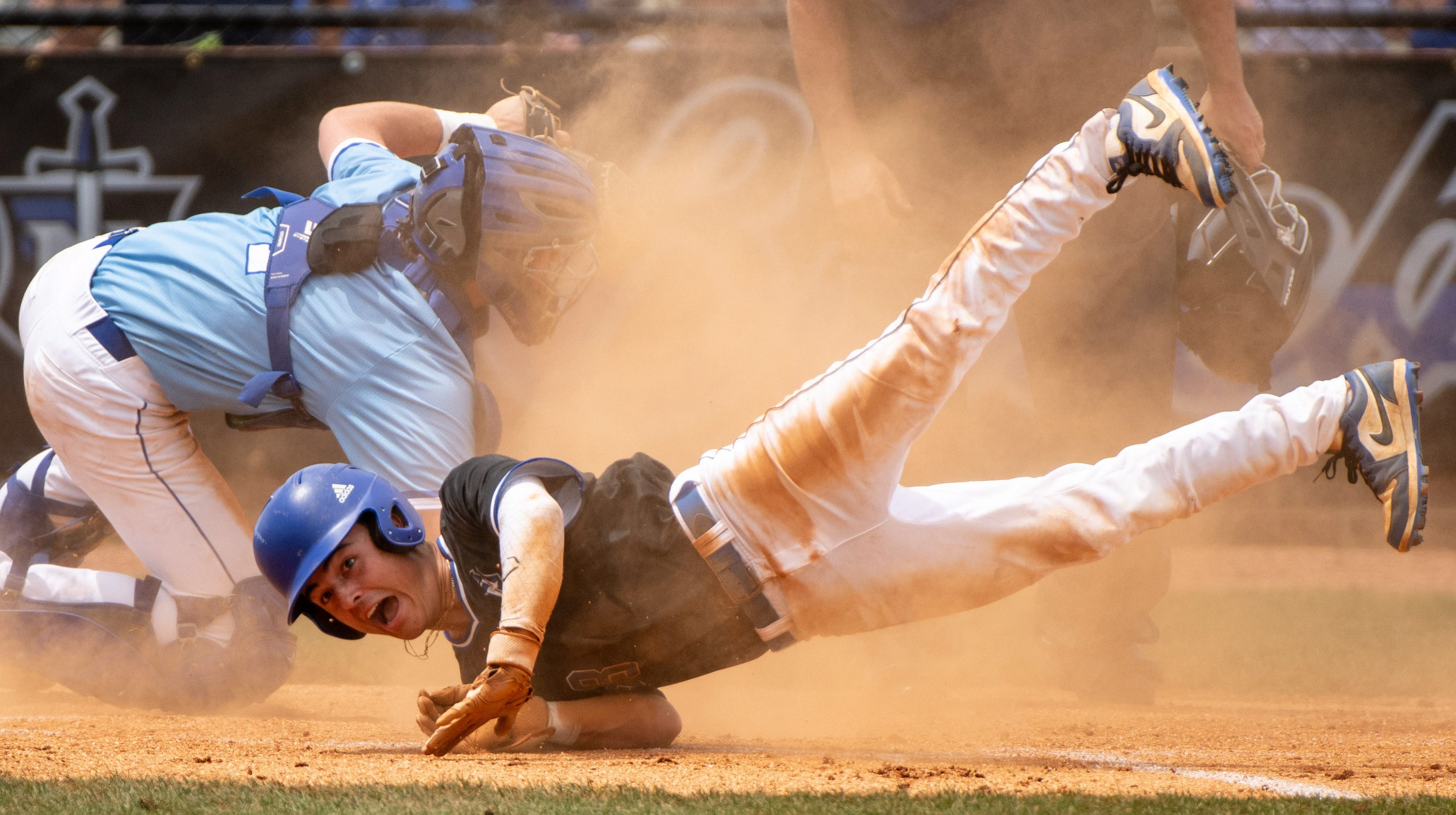 Nolensville High School Keagan Meece (38) crashes into home plate during his game against Brentwood High School at Nolensville High School in Nolensville, Tenn., Sunday, May 5, 2024.