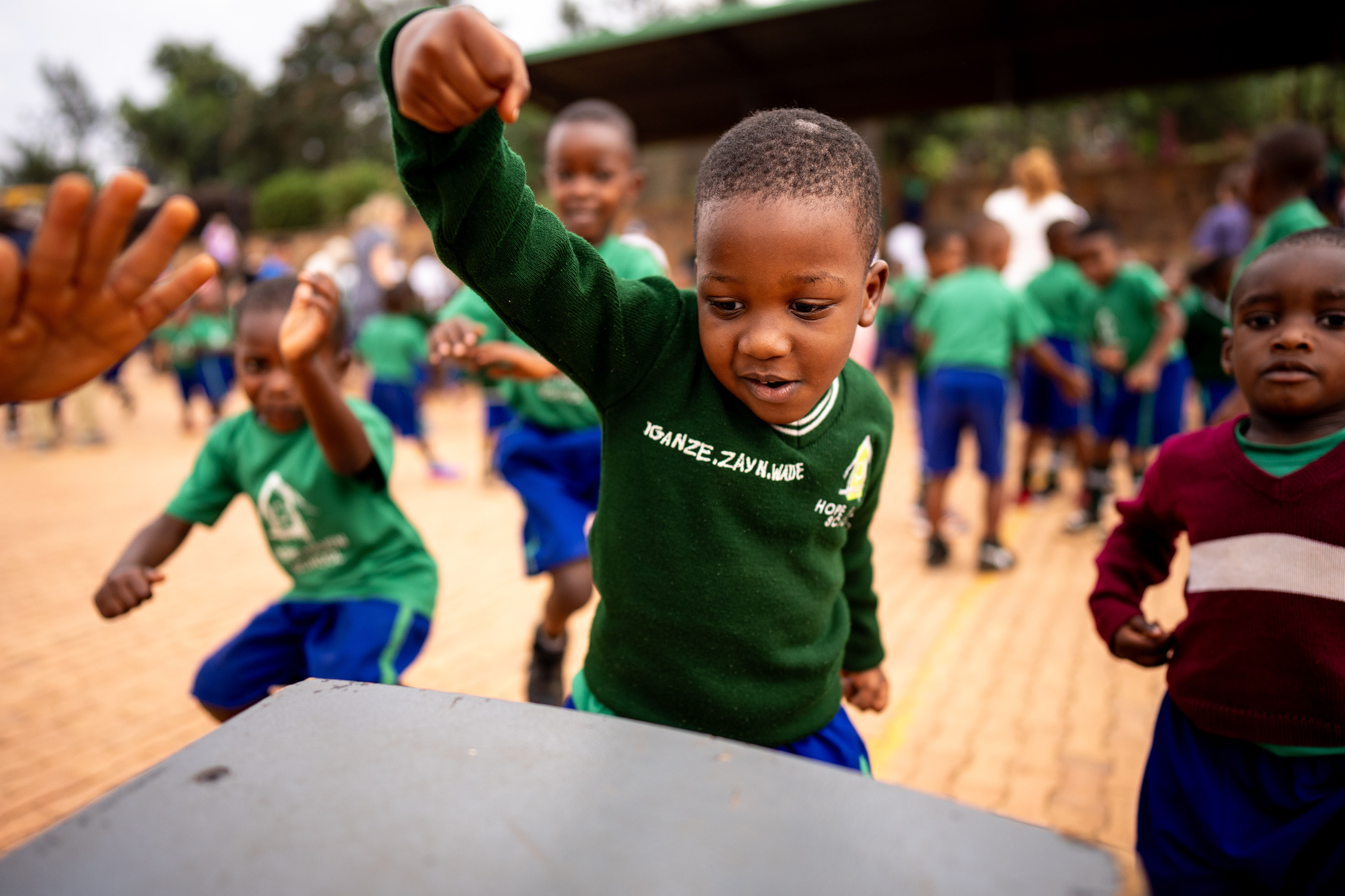 Iganze Wade, a primary student, dances during a school assembly at the Hope Haven School near the Murindi Village in Kigali, Rwanda, Wednesday, March 5, 2025.