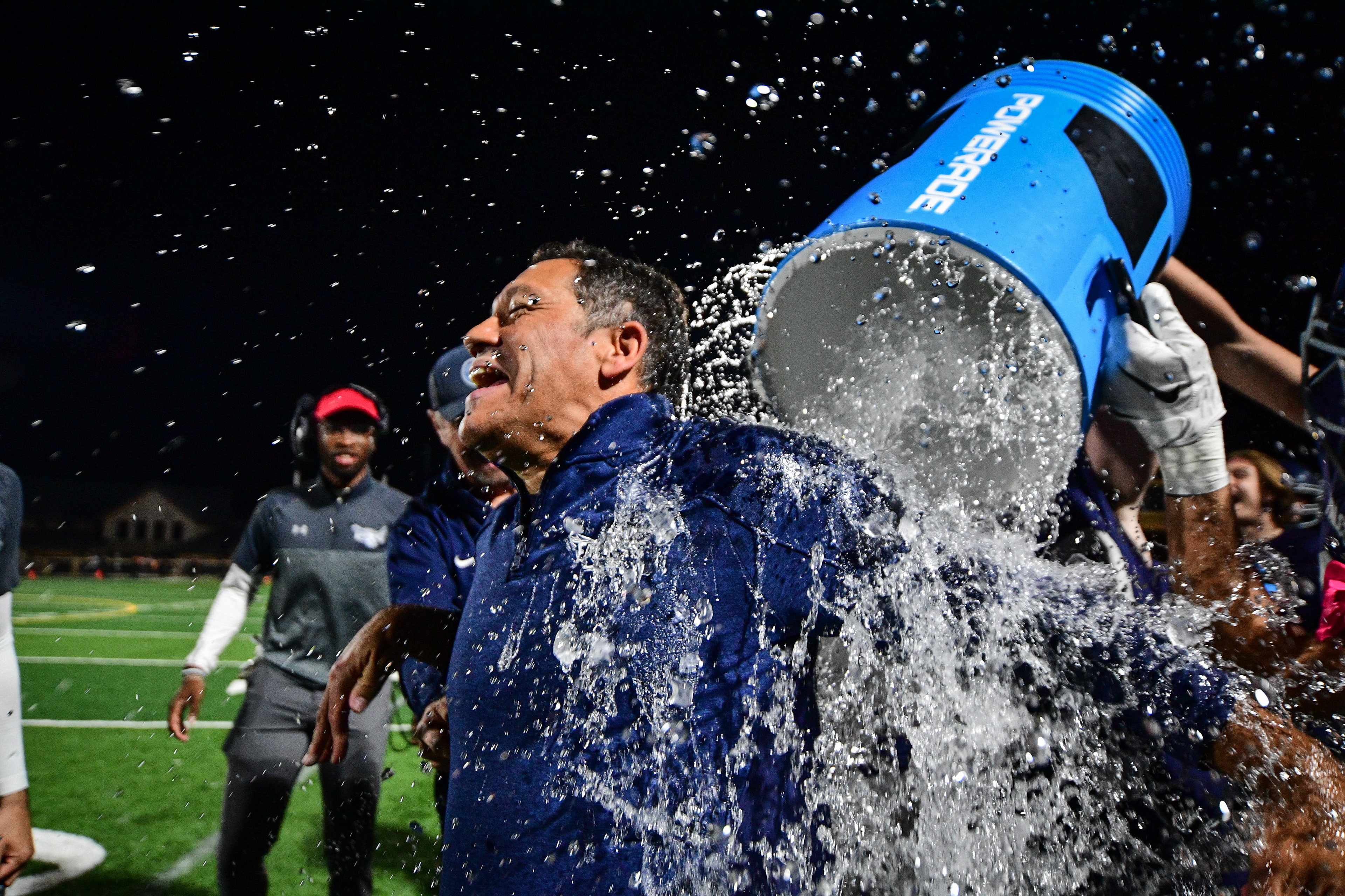 Members of the Franklin Christian Academy football team dump a bucket of water on head coach Tim Johnson after defeating Providence Christian Academy in the TSIAA state tournament at Franklin Christian Academy  in Franklin, Tenn., Saturday, Nov. 5, 2022. 