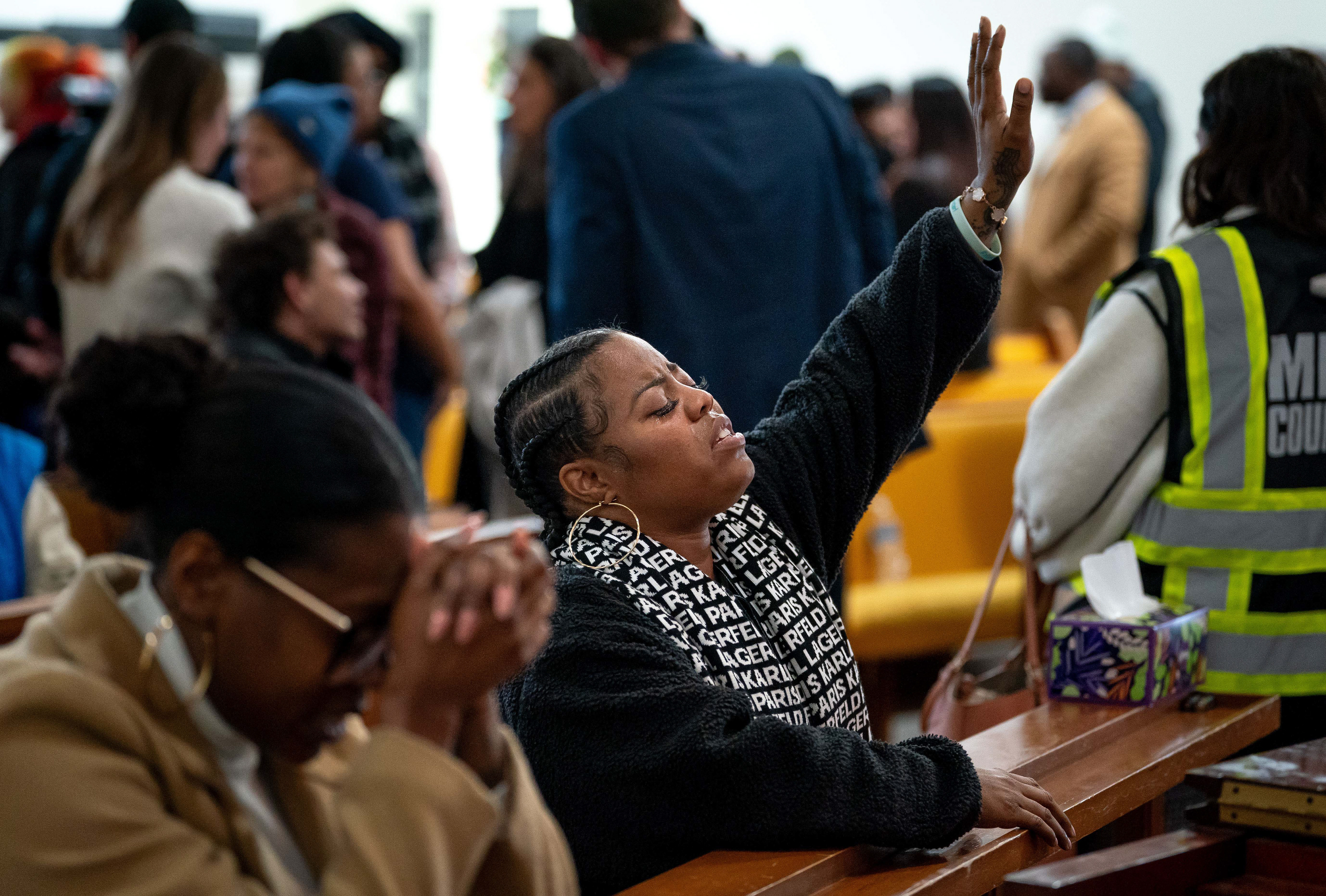 Domonique Grant prays during a vigil at Hamilton United Methodist Church in Nashville, Tenn., Wednesday, Jan. 22, 2025. The vigil was held in response to a school shooting at Antioch High School that left two people dead, including the shooter. 