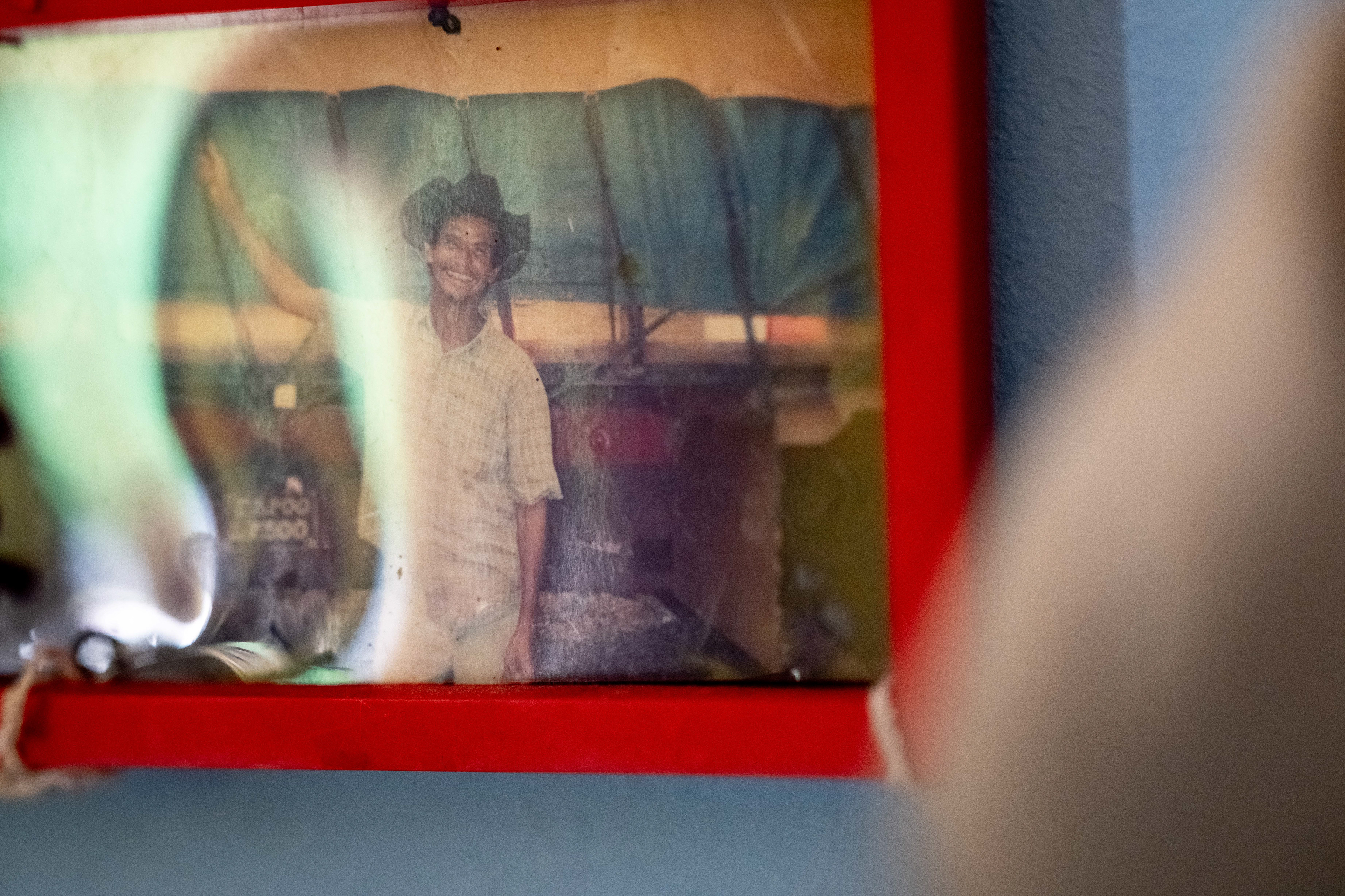 An old photograph of Pipa is displayed on the wall of his at the Saint Vincent de Paul Home in Cidade de Goiás, Go., Friday, March 6, 2026. Living with an intellectual disability, he often turns to music as a way to spend his time. (© Camden Hall)