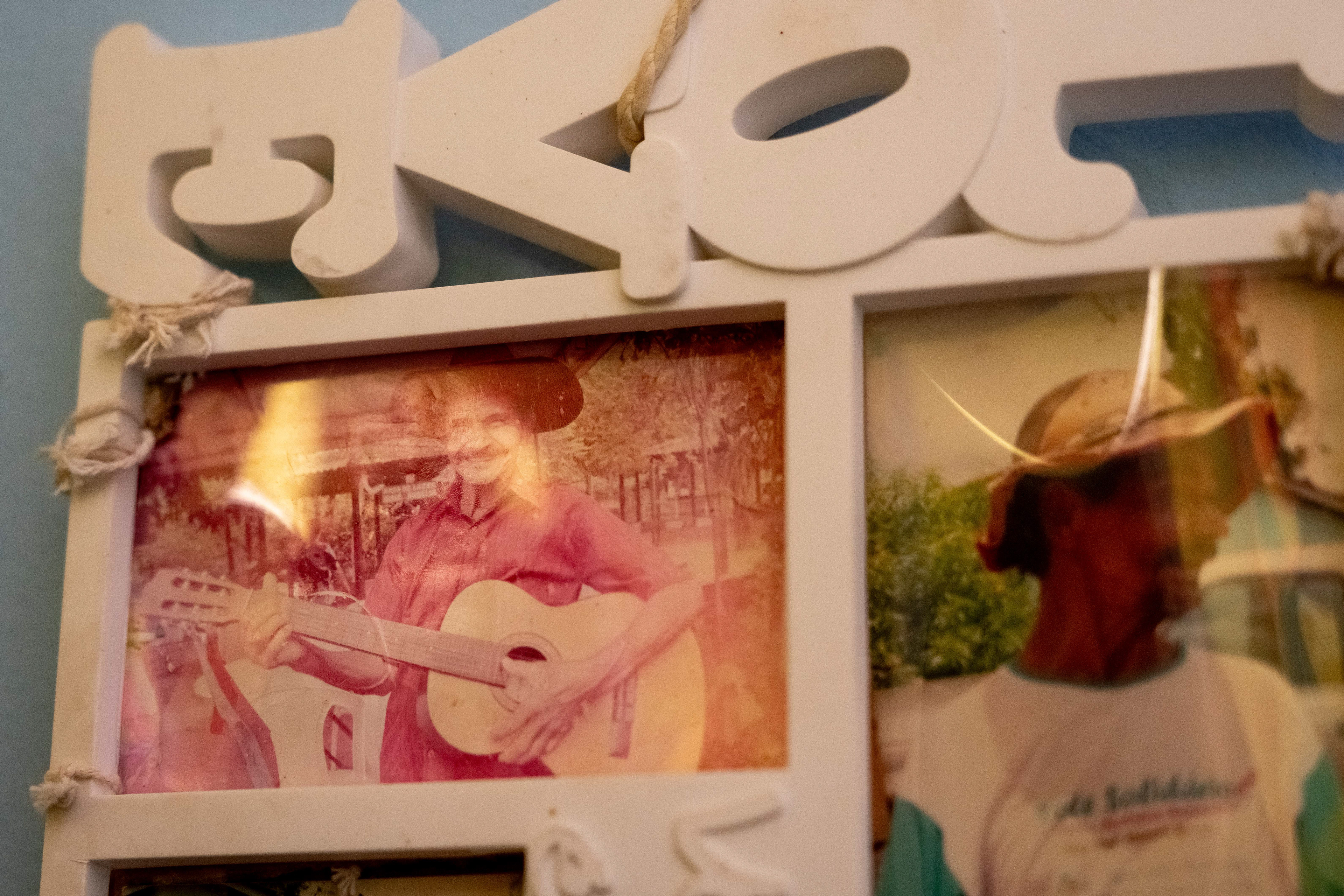 An old photograph of Pipa is displayed on the wall of his at the Saint Vincent de Paul Home in Cidade de Goiás, Go., Friday, March 6, 2026. Living with an intellectual disability, he often turns to music as a way to spend his time. (© Camden Hall)