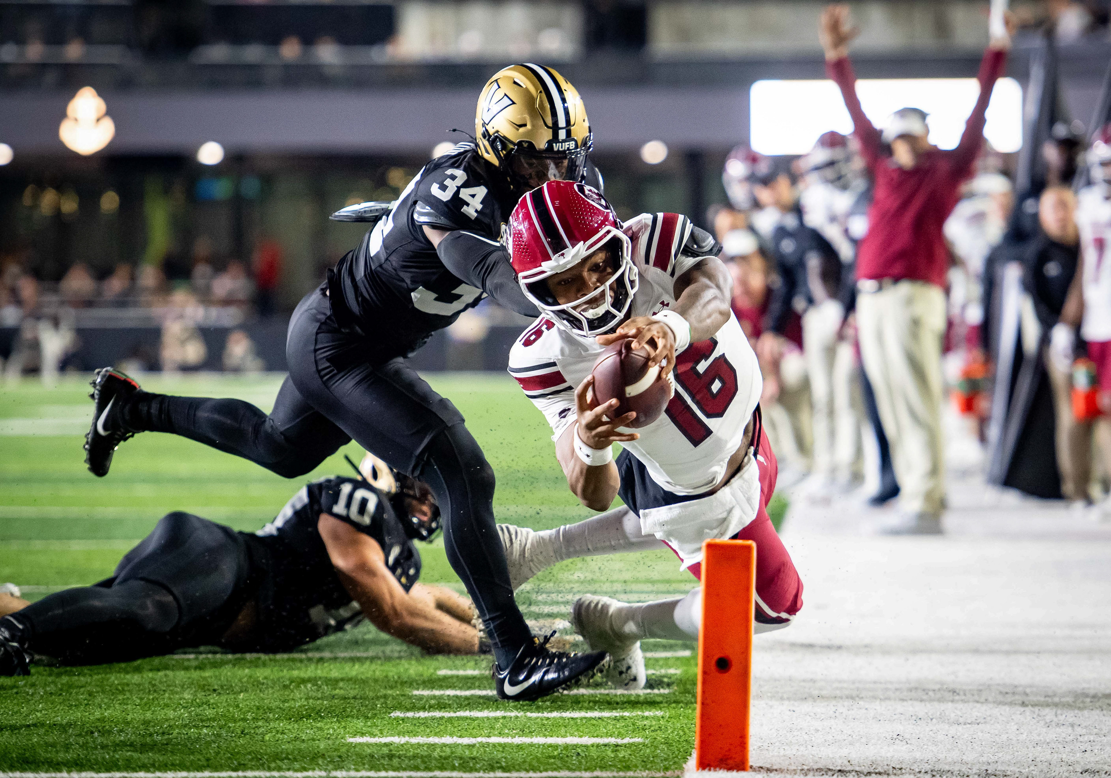 South Carolina quarterback LaNorris Sellers (16) dives into the end zone while evading Vanderbilt linebacker Maurice Hampton Jr. (34) during an NCAA college football game at FirstBank Stadium in Nashville, Tenn., Saturday, Nov. 9, 2024.