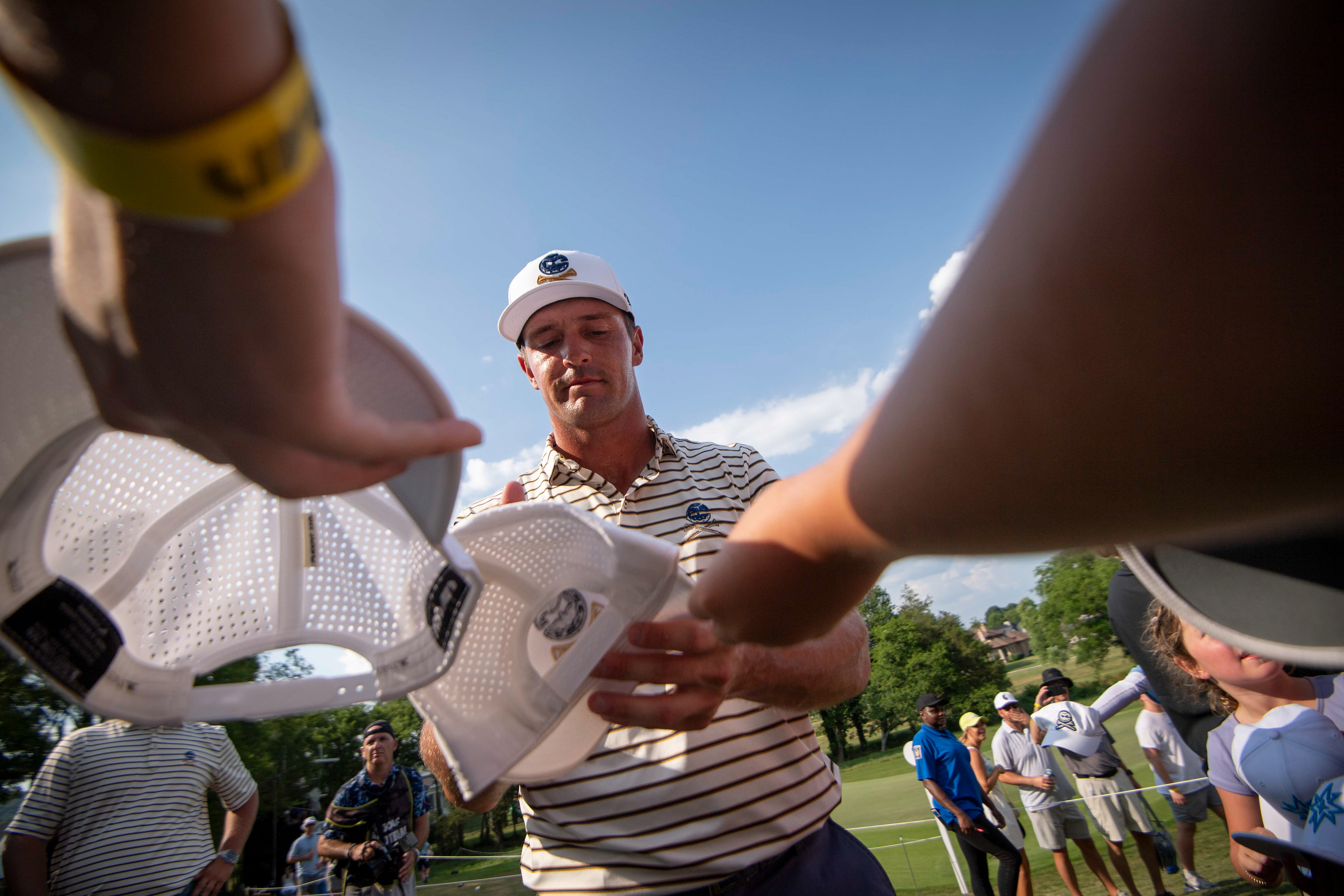 Bryson DeChambeau of Crushers GC signs autographs after finishing his round of golf on day 2 of the LIV Golf Tournament at The Grove in College Grove, Tenn., Saturday, June 22, 2024.