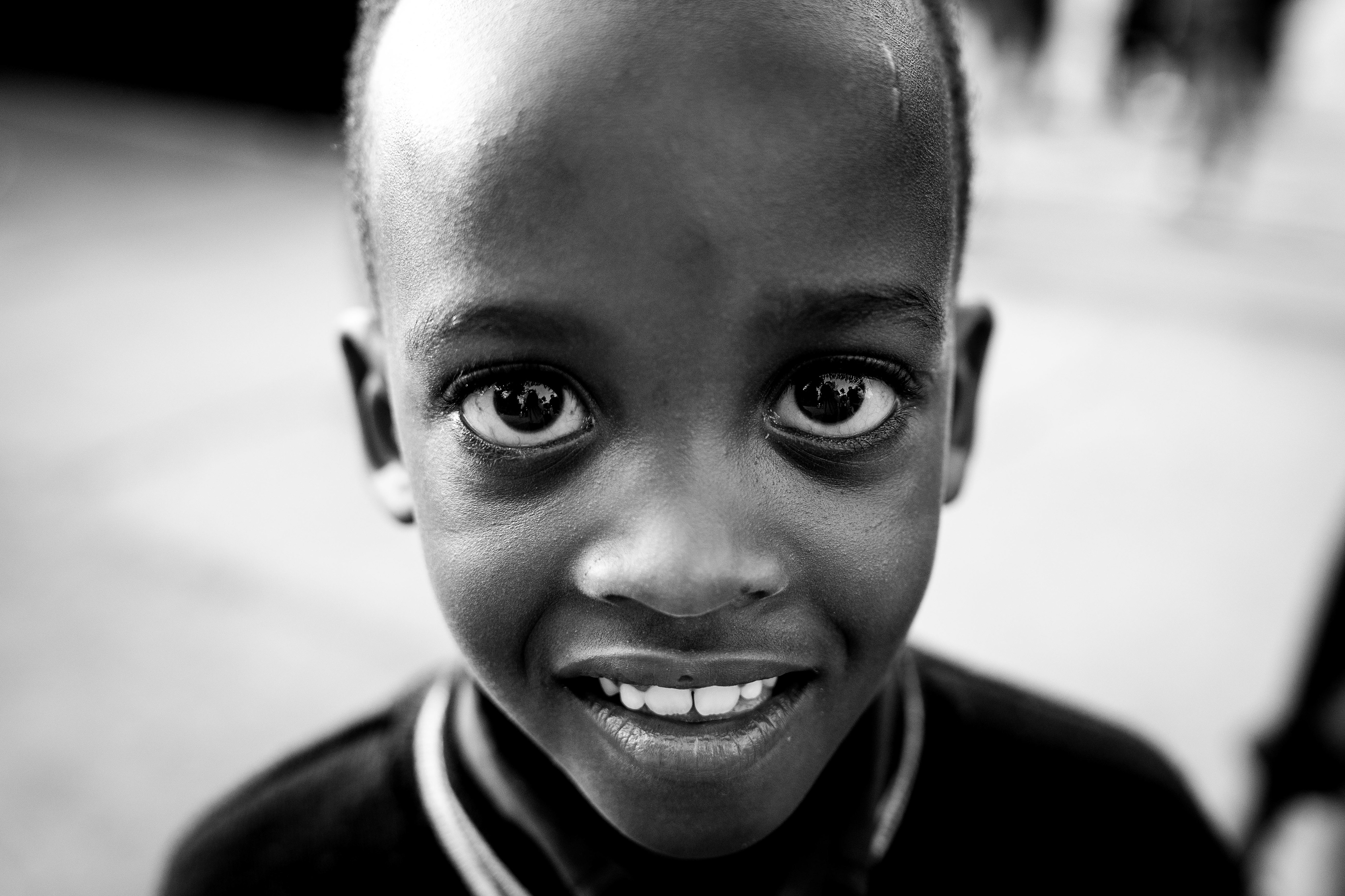 A primary student smiles for a photograph at the Hope Haven School near the Murindi Villiage in Kigali, Rwanda, Tuesday, March 4, 2025. 