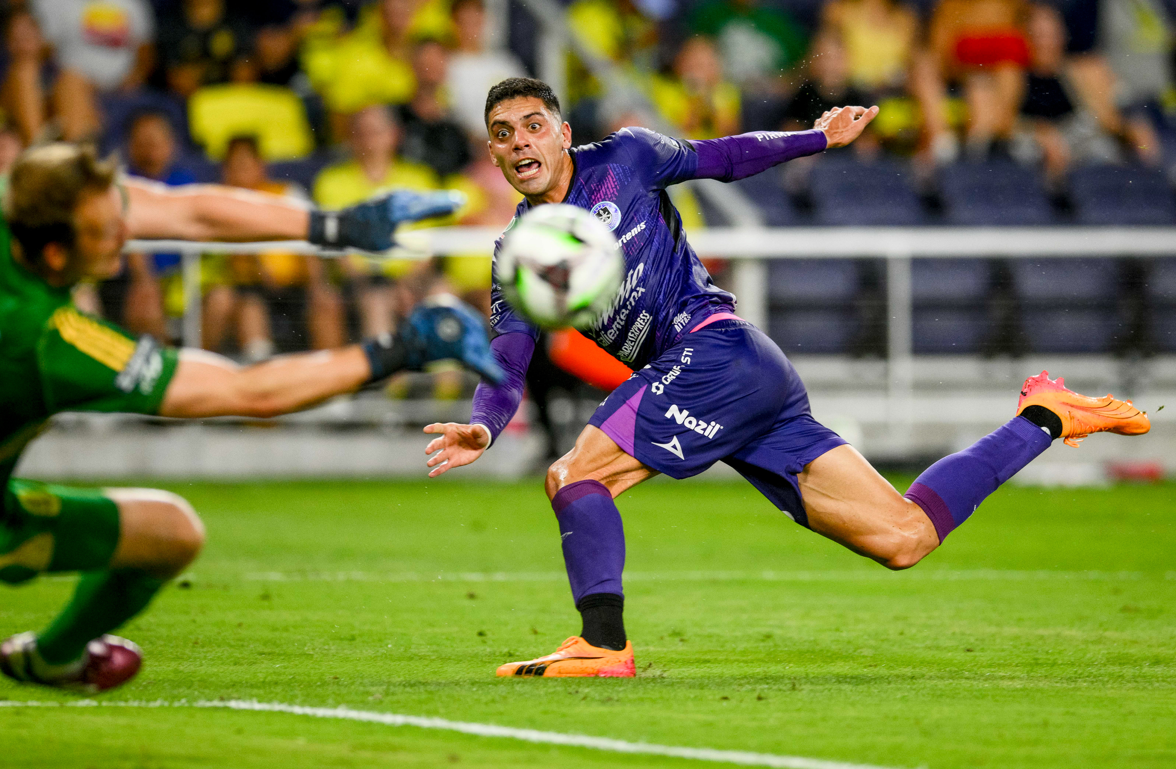 Mazatlán forward Aké Loba (9) shoots on goal while Nashville SC goalkeeper Joe Willis (1) blocks the shot during their Leagues Cup soccer match at Geodis Park in Nashville, Tenn., Wednesday, July 31, 2024.
