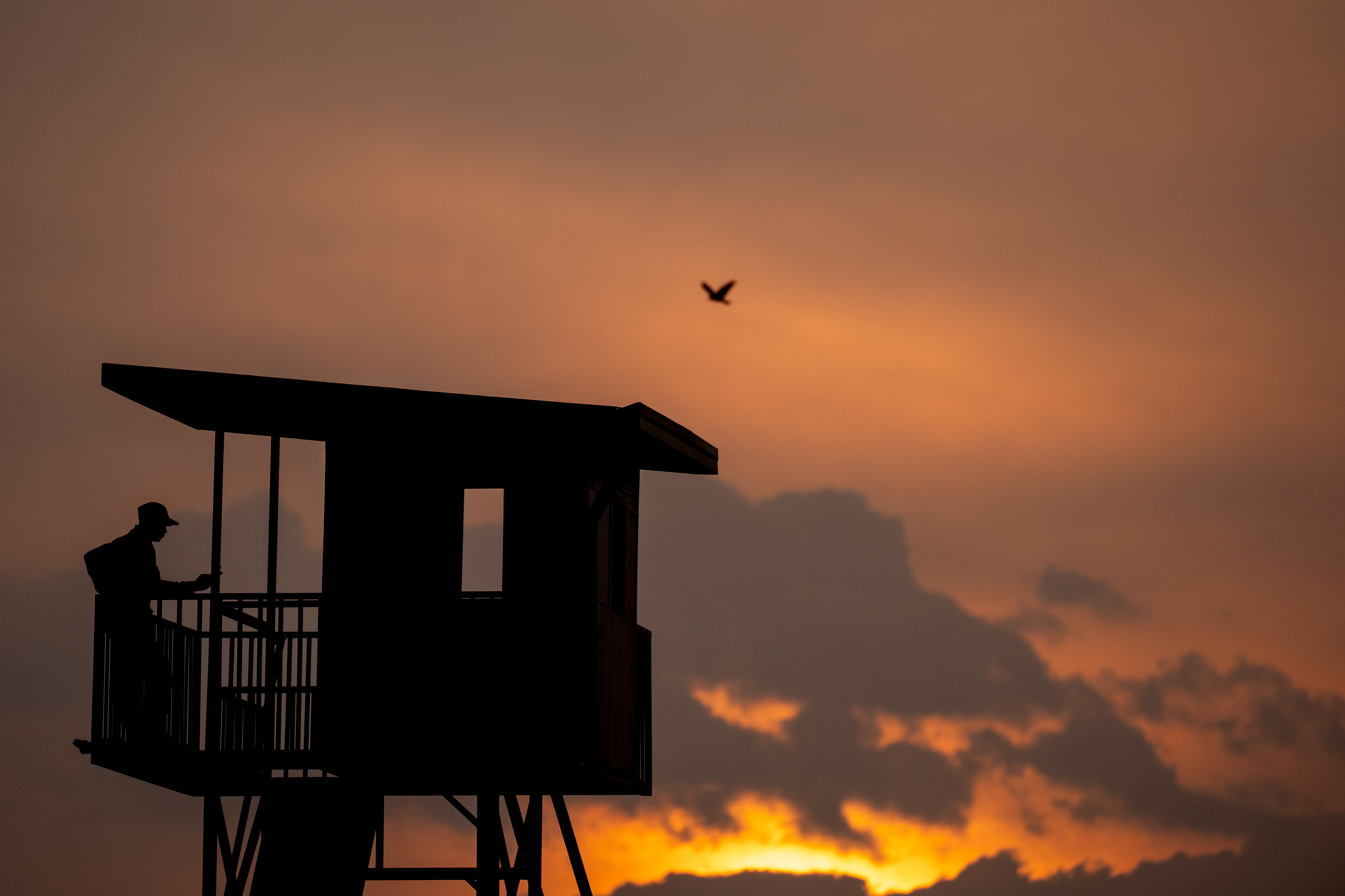 A security guard watches over the Hope Haven School campus from his guard tower near the Murindi Village in Kigali, Rwanda, Thursday, March 6, 2025. 